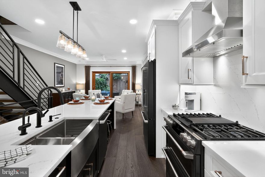 Experience the height of city living in this gorgeous Federal-style townhome in the heart of Washington Square West!

Featuring 2 bedrooms plus a loft space, 3 spa-inspired bathrooms, and a fully finished basement. This home blends timeless charm with modern luxury. The open-concept main floor showcases solid oak hardwood floors, high ceilings, crown molding and recessed lighting throughout. The chef's kitchen has a Cambria quartz waterfall island, countertops and seamless backsplash with solid wood cabinets and upgraded GE Cafe matte black appliances. Exposed brick walls, a gas fireplace with marble thresholds, and oversized glass doors extend the living space to a private walled garden and patio-perfect for entertaining or unwinding. Upstairs, two generous bedrooms feature custom closet systems, There is Juliet balcony access from the second floor primary bedroom with a primary bathroom that is fully tiled with Carrara marble and absolute black granite floor. The top floor is dedicated to a recently renovated guest suite with heated tile floors, glass-enclosed shower, built-in storage, and an adjoining den/home office designed for today's lifestyle. The fully finished basement provides an additional media/family room, multiple storage closets, and updated mechanicals, creating both functionality and flexibility. Nestled in the coveted McCall Elementary School catchment, this home offers a Walk Score of 99, placing Center City's finest restaurants, cafés, shopping, nightlife, and cultural destinations just steps away.

Offering the perfect balance of elegance, convenience, and vibrancy, this residence represents urban living at its absolute best. Schedule your appointment today to experience this exceptional property.