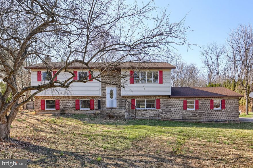 Updated Bi-Level in the country, sitting on just over 1.5 acres.  Rural setting but still close to all amenities.  Open floor plan and plenty of space.  Updates include TWO new kitchens, cabinets, & stainless steel appliances.  Refinished hardwood floors & new laminate flooring.  All new doors, interior and exterior.  Several new window replacements.  Lower level has been completely remodeled to include a secondary kitchen, spacious family room with tile flooring & wood stove, a 4th bedroom, new full bathroom, and spacious bonus room which could be an office or oversized mud room.  New HVAC, water heater, water softener, & septic tank.  Large rear deck has been rebuilt and is great for overlooking the back yard.  All this work and freshly painted through makes this home move in ready.  Call today for a tour!