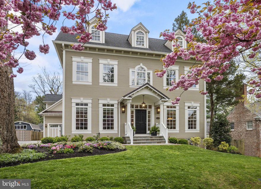 OPEN HOUSE CANCELLED - Home is now under contract. 

Discover a rarity in sought-after AU Park—4220 Van Ness St NW, a custom-built masterpiece nestled on a cherry blossom-lined street. Constructed in 2020, this expansive home spans four levels, features a main level bedroom with ADA accessibility, and includes intricate crown molding, wainscoting, and arched thresholds that underscore its meticulous design. Every detail was carefully considered with an emphasis on allowing an abundance of light to enter the home through strategically placed windows and white reflective trim work, complemented by the beautifully refinished hardwood flooring and accent features. 

As you step inside, you're greeted by beautifully refinished hardwood flooring and soaring 9-foot ceilings adorned with elegant crown molding and coffered-like designs, creating an atmosphere of grandeur.

The heart of the home lies in the beautiful chef's kitchen, featuring Carrara marble countertops, stainless steel gourmet appliances, and a Wolf 6-burner-plus-griddle gas range with dual electric ovens. The kitchen seamlessly flows into the adjoining family room, complete with a charming corner fireplace and a connecting Butler's pantry with a walk-in pantry, ideal for effortless entertaining.

Formal dining and living spaces exude timeless charm, with the formal dining room showcasing built-in china and glassware cabinetry, finished with Carrara marble counters, and the living room boasting an elegant mantel over the gas fireplace and stunning arched grand entrance.

The main level library/bedroom, designed with ADA accessibility in mind, offers the possibility for easy one-level living, adding convenience and versatility to the home's layout.

As you move to the second level, you will find 4 bedrooms, including a stunning Primary Bedroom Suite with a private balcony and a luxurious Primary Bath adorned with designer marble, heated floors, and separate water closet. Additional bedrooms offer ample space and privacy, with the 2nd bedroom boasting its own full bath and walk-in closet, while the 3rd and 4th bedrooms share a Jack and Jill bath.

The third level offers a beautiful open space with 2 bedrooms, a full bath, and classic dormers that add colonial flair, providing additional living or recreational space.

The lower level includes a large entertaining space and is a fully-equipped kitchen, complete with modern appliances, ample counter space, and sleek cabinetry. There is also a separate bedroom with its own full bathroom, providing a private retreat for guests or family members. 

For added convenience, there is a separate au pair suite/guest apartment above the spacious 2-car garage that offers flexibility and privacy, with its own entrance, vaulted ceilings, exposed beams, Carrara marble counters, and a private balcony.

The exterior includes a large fenced-in backyard with two gates, offering tranquility and security, while the spacious motor court provides parking for up to 7 cars, including a 220-volt EV charging outlet in the garage.

Experience the epitome of luxury living at 4220 Van Ness—a place where every detail is meticulously crafted to provide the utmost in comfort and timeless elegance.