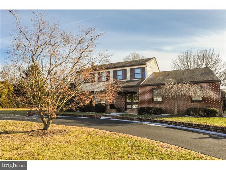 Handsome well kept colonial on large level lot in convenient Collegeville/Skippack location.  Oversized parking area PLUS a circular driveway bordered in brick.  Covered front porch with plenty of room for some rocking chairs to enjoy the serene street view.  Double doors take you into the spacious foyer with expanded closet. (notice that most of the doorways on the first floor are rounded arches)  A bay window brings lots of light into the living room.  The square dining room offers plenty of space for entertaining family and friends. Stainless steel dishwasher and stove update the kitchen.  The family room has lovely wood finishes and a newer wood faced door which  looks out on the covered brick porch.  This home gives the flexibility of a first floor or basement laundry (hook ups both places).  Two car side entry garage with automatic door opener.  Downstairs is a huge recreation room with built in bar and wood paneling. A cozy friendly space with lots of potential.  Upstairs on the second floor are four good sized bedrooms and two full baths. If you're fortunate enough to be in the market for a wonderful home be sure and put this one on your MUST SEE list.