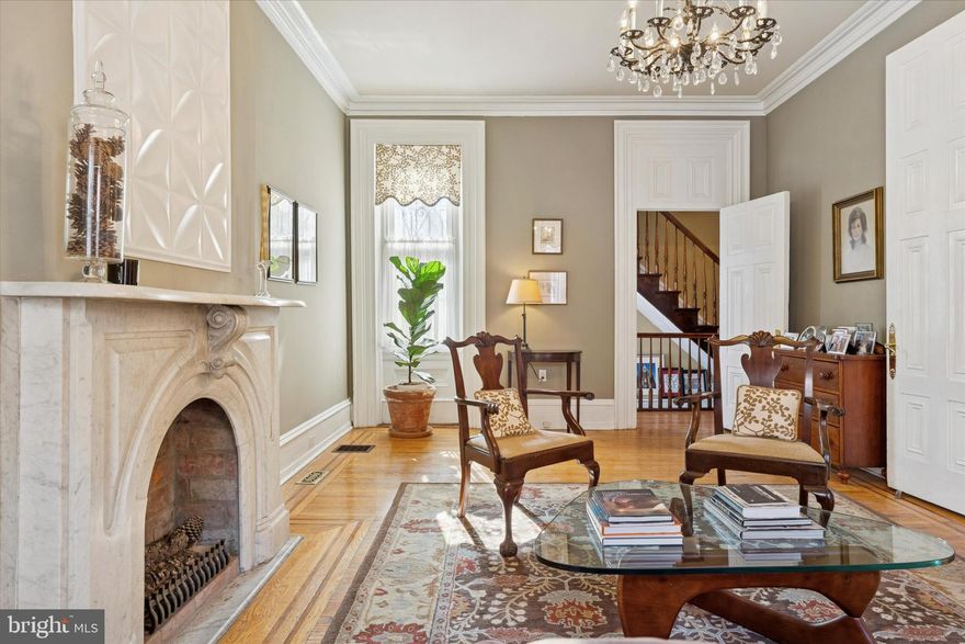 Welcome to this exceptional 18-foot-wide by 78-foot-deep historic residence in Rittenhouse Square. Blending timeless architectural character with thoughtful modern upgrades, this well-maintained 4-bedroom, 2.5-bath home offers gracious proportions, refined detail, and the luxury of private outdoor space in the heart of the city. From the moment you enter, original architectural elements set the tone—soaring ceilings, intricate millwork, hardwood floors through out and beautifully preserved period details reflect the home’s rich heritage. Expansive living and inviting dining room create an elegant setting for entertaining, while abundant windows fill the home with natural light. The updated kitchen with heated floors seamlessly merges classic style with modern convenience, featuring stainless steel appliances, custom cabinetry, and a generous counter bar. Adjacent is a spacious dining area with custom built-ins and a warm, inviting ambiance. A large powder room and dedicated laundry room add everyday functionality. Just beyond, the private rear yard offers a tranquil retreat—ideal for outdoor dining, gardening, or quiet relaxation. Upstairs, four well-proportioned bedrooms provide exceptional flexibility. The beautiful primary suite is located on the second floor and is complemented by a dedicated home office (also ideal as a nursery or gym). A remarkable, oversized dressing room connects to a spacious, nicely appointed primary bath. The third level features two additional bedrooms. The fourth bedroom, currently used as a family room/den, includes an ensuite bath, offering versatility for guests or additional living space. The basement is clean and dry with impressively high ceilings and abundant storage. Located within the Greenfield School catchment and just steps from world-class dining, shopping, theaters, museums, and convenient access to Philadelphia International Airport, this residence presents a rare opportunity to own a piece of Philadelphia history—thoughtfully updated for today’s lifestyle.