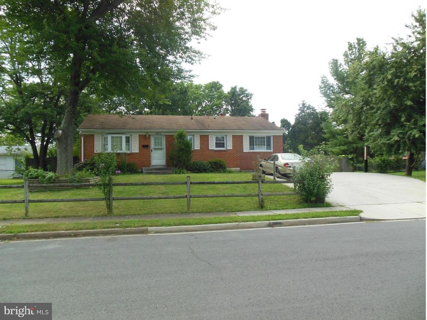 Comfortable Living...   Big Lot !     One Bedroom right off the Living Room    2  Good-Size  Bedrooms  w / windows facing a Large   Backyard !   Open  Galley Kitchen for many family gatherings    freshly Painted    new Pergo flooring     Heating/Cooling System (2012)  Electric Water Heater(2013)   Detach 2 Car Garage w / Double Wide Driveway   Fenced in Yard  w / Gate   Lots of Space for Value !