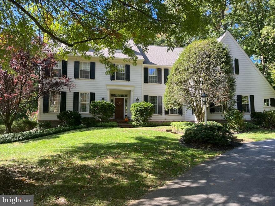 Plan to visit this stunning  custom built  home in Wayne, designed by Ann Capron and built by B J Drueding.  You will fall in love with this  gracious home on a quiet, tree lined street that affords maximum privacy and interior views from the large  windows that make you feel you are still out in nature.  The lovely wooded property extends to Eagle Road.  While it is a traditional home outside there is an open concept for living  with lots of natural light and a wonderful flow for entertaining. The bright kitchen provides lots of cabinets, island space and a sunny dining area for family meals.   The main floor is beautifully appointed -- easy to envision yourself  living in luxury.   The main floor also has an office or den that is ideal for working from home.   Use one of the two staircases that will take you to the second floor where  the spacious primary bedroom has a dressing area with two very large walk in closets. One of the other four bedrooms is  en suite with sitting area and private full bath, perfect for guests that you will be hosting.  The lower level  finished basement has  a living area with full French doors and another bedroom and full bath, perfect for additional guests or for an au-pair for a total of 6 bedrooms, but there is still plenty of storage  and a workbench  for your use.  And you will love keeping fit by working out  in the gym.  This home has been well maintained  with (3) newer garage doors,  newer gutters and downspouts,  newer Pella windows, new Azek deck w/ guarantee.  The stucco has recently been replaced with high end  Hardie Board siding and  new brick skirting providing a  lovely exterior that you will enjoy for years to come.   An ideal location in the Radnor School District and Fenimore Park right across the street.  Close to the shops of Main Street Wayne, a Cinema and restaurants makes this the perfect place for comfortable living.  Schedule a visit now to view this impressive home--you will love what you see!               (Please note: it is easy to miss the turn off for Paul Road.  There will be a small address sign directing to 2,4,6,8 .  It is opposite the children's playground at Fenimore Park)     Please be sure to view the video of this lovely home.