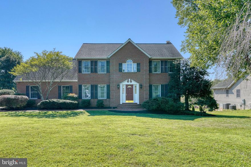 Come home to this well-loved 4 bedroom, 3.5 bath, 2 car garage brick front colonial on 1+ acres of mature landscaping with a park-like feel in sought after Finksburg.  A beautiful brick walkway leads to the front door, from there you enter to a lovely foyer with solid oak hardwood and crown molding.  The hardwood and crown molding continue through the living room and formal dining room.  The light filled family room has a wood burning fireplace and custom built in bookcases. Custom Anderson windows and a French Door leads to a spacious deck (Timbertech/composite decking) and is perfect for entertaining! The eat-in kitchen offers ample cabinet space, a pantry and slate floor tile. Off the kitchen is the sunroom with hardwood flooring. It is a perfect retreat to capture all the beauty outside while remaining cool or warm as it has its own Mitsubishi mini split. Additionally, there are 2 Anderson French Doors leading to the deck.  Head upstairs to find 4 bedrooms and a bonus room. The bonus room offers plenty of space for an office or a playroom or even a 5th bedroom. There is also access to the eaves for additional storage. The primary bedroom has a dual vanity, jacuzzi tub and large walk-in closet. No more running up and downstairs, the laundry is conveniently located on the second floor. Second full bathroom tops off the 2nd floor. Head down to the inviting finished basement with ample storage, the 3rd full bath and a walk-out to a stoned patio. The homeowners had the area below the sunroom enclosed to allow for additional outdoor storage.  All of this and a 2-zoned HVAC system installed in August 2021; Roof w/ Architectural Shingles and 30 yr transferable warranty in 2013; Driveway was repaved in 2020 w/turnout. The quietness will make you forget how convenient you are to shopping and close proximity to Baltimore, BWI, DC.  Make this home yours today!