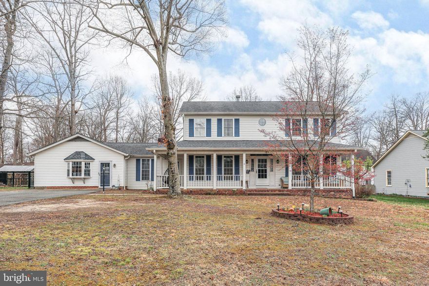 Nestled in a quiet cul-de-sac in Ferry Farm, 61 Cornwallis Drive is a classic Virginia colonial with timeless charm. Lovingly maintained by its current owners since 2006, this spacious home offers over 3,000 square feet of living space, including four bedrooms and 3.5 baths. Recent updates include a refreshed kitchen and brand-new carpeting, adding a fresh touch to its inviting interior. It sits on a .32-acre lot along the northern edge of the Ferry Farm community. Zooming in on the acreage, which is tucked just off a cul-de-sac, you’ll see an asphalt driveway, dots of stately trees and green grass aplenty in its front yard. The home – which is white with popping light blue shutters – has a white column-clad front porch for enjoying your coffee in the morning. Out back, a great backyard awaits, complete with a newer concrete patio, flower beds and a storage shed for all of your lawn equipment. Stepping inside the two-level residence, hardwood flooring and inspiring spaces greet you. The main level includes a dining room, living room (with gas fireplace!), half bath and modern kitchen. The kitchen was updated in 2022 and includes elegant blue cabinetry, butcher block countertops, stainless steel appliances and sliding glass door access to that expansive patio! A must-see on the main-level is the garage that has been converted into a super-sized playroom and office area, complete with luxury vinyl plank flooring, bay window bliss and a sliding glass door to the back yard – what a space! Still on the main level, we can’t forget the primary bedroom set-up! It includes a walk-in closet and ensuite bath with a long vanity, glass doored shower and soaking tub. Heading upstairs, you’ll find three bedrooms and two full baths. And, yes, there is a second primary suite upstairs! It includes a walk-in closet and ensuite bath complete with a tub/shower combo. All of the bedrooms upstairs have brand-new carpet! Of the additional two bedrooms, one has a walk-in closet and the other has two side-by-side closets. The final full bath includes a tub/shower combo and single sink. Rounding out the upper level is the laundry room with front-loading machinery. For extra storage space, the home has a crawl space and there is attic space above the playroom / office area. Systems-wise, the home’s HVAC and hot water heater have been regularly maintained. Beyond the homesite here, so much Stafford County and Fredericksburg region charm is within minutes. For commuters, four I-95 exits (Centreport Pkwy., Route 17, Route 3 and Massaponax) are within 15 minutes. Two VRE stations (Leeland Road and Fredericksburg) are within 10 minutes. The heart of Downtown Fredericksburg, the University of Mary Washington and Mary Washington Hospital are all within 10 minutes. Spanning its fresh kitchen, quiet cul-de-sac location and incredible convenience... you have so many reasons to check this one out!