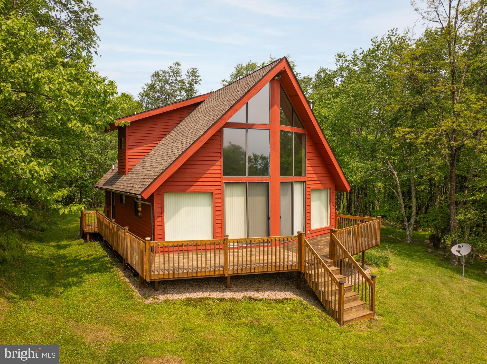 Check out this opportunity to own your own mountain top chalet getaway complete with 3 bedrooms and 2 bathrooms and situated on 3 acres. A peaceful setting amongst mature trees and abundant wildlife with views of the surrounding mountains. Backbone Ridge community borders the highest point in Maryland and is conveniently located to several ski resorts, state parks, national forest & entertainment options in nearby Canaan Valley, as well as Deep Creek Lake. This particular property's acreage offers it's new owners expansive views with a little bit of clearing all while remaining secluded at the peak of the mountain. Call today to schedule your showing!