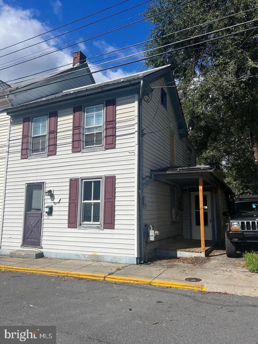 Calling first time buyers or investors!  This is a spacious home located within the city limits of Martinsburg. Large fenced in backyard, separate laundry room, original hardwood floors throughout the home. All appliances convey. Schedule an appointment to check out this house before it's gone! This property is reduced and  is being sold as is, seller will not agree to any repairs.