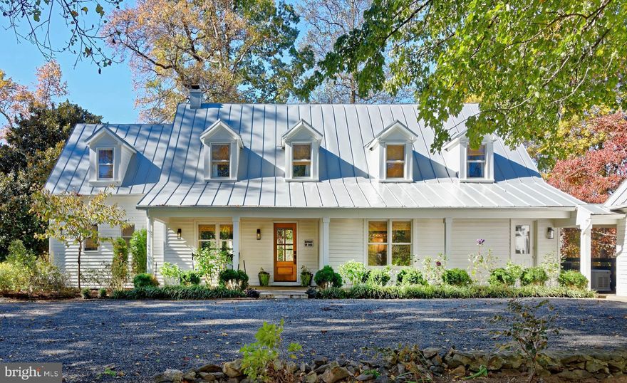 Tucked along one of Rappahannock County’s most picturesque roads, Saga Farm is a 50-acre country estate where timeless charm meets modern refinement. Set high on a rise with sweeping Blue Ridge views, the beautifully renovated Cape Cod residence anchors a landscape of pastures, gardens, and quiet mountain scenery. Inside, warm walnut floors, stone fireplaces, and custom millwork create an inviting sense of home, while the stunning new kitchen—with quartzite counter tops, La Cornue range, and Miele appliances—sets the stage for gatherings both grand and intimate. Outdoor living unfolds across flagstone terraces, a pool and gazebo, firepit, and a fully equipped outdoor kitchen. Completing the property are a three-car garage with guest suite, an eight-stall center aisle barn with renovated apartment, four paddocks and excellent ride-out. With its proximity to Shenandoah National Park and location in the heart of Old Dominion hunt country, Saga Farm captures the very best of Virginia country living. Property is in a VOF conservation easement.