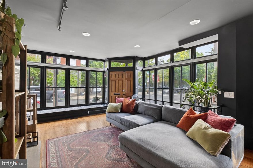 Welcome to 822 S. 5th Street, a sun-drenched corner home in Queen Village. Formerly this building was used as a gas station and then a tailor shop before becoming a single family home!

This unique three-story, 2 bed/ 2 bath townhome has both south and east-facing floor-to-ceiling windows with window seats, a wood burning fireplace in the living room, and a lower level eat-in kitchen with a pantry, laundry room, and  light well.  On the second floor, you'll find a large bedroom with two closets and a full bathroom with a tub. Climb the stairs to the third level, which is lit by a beautiful skylight and features a large primary bedroom with sliding barn door and a bright ensuite bathroom. The primary bedroom is spacious with two closets and windows on both the south and east-facing walls. The bathroom features a dual sink vanity and a huge walk-in shower with custom rolling glass door and shower bench. Outside there is an original cornice, permanent patio table, and trash hideaway.

Located in a true "walker’s paradise," it's steps from award-winning eats like Royal Sushi & Izakaya, historic haunts like Famous 4th Street Deli, and local favorites such as Shot Tower Coffee, Tattooed Mom's, and New Wave Cafe. Just a short distance to the shopping on Fabric Row, outdoor fun at the Delaware River Waterfront, and the culinary delights of the Italian Market. Easy access to I-95 and public transit.

This is your chance to own a one-of-a-kind corner home in the heart of one of Philly's most vibrant and sought-after neighborhoods.