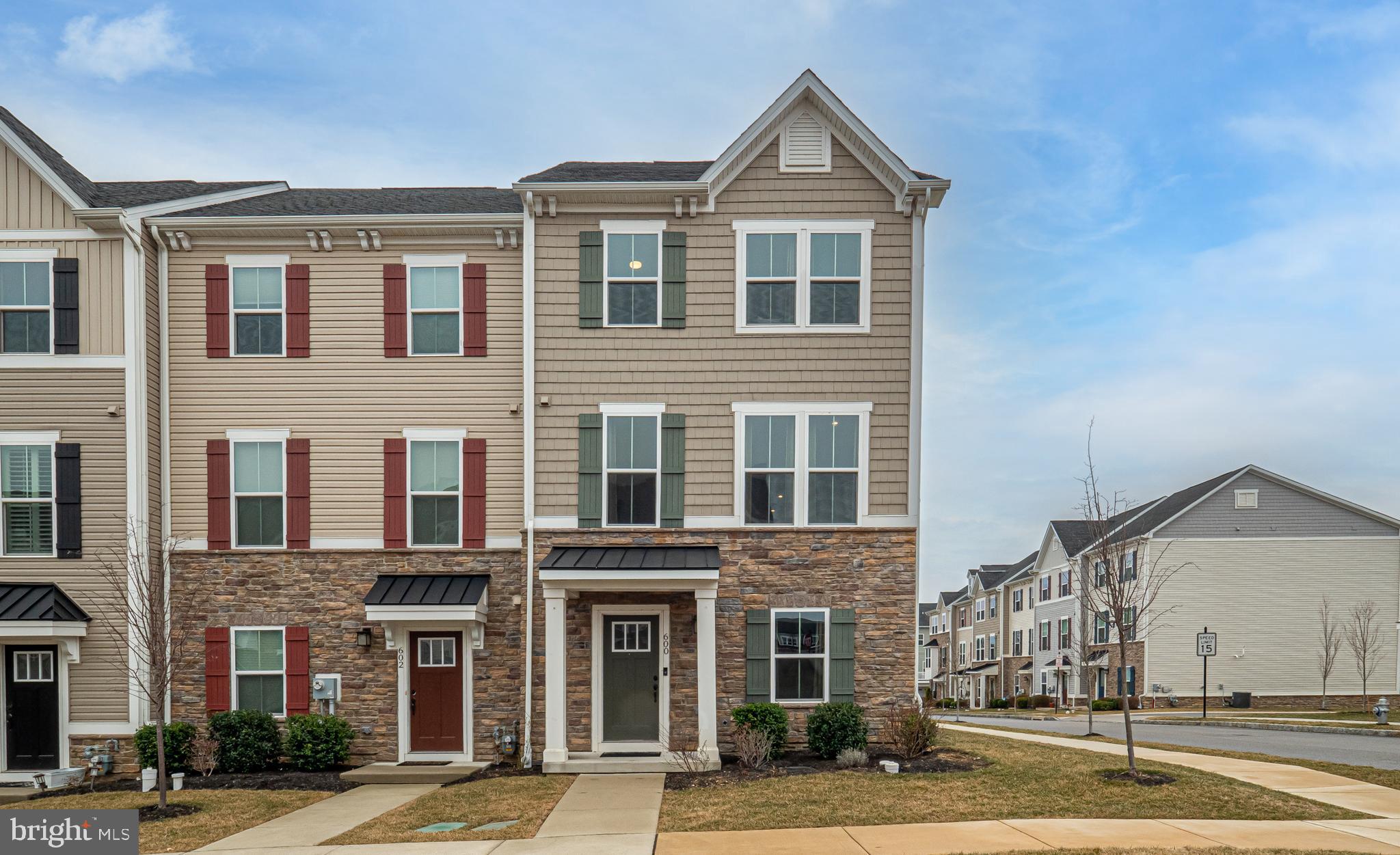 Welcome to 600 Holywell Drive, a meticulously maintained townhome loaded with upgrades in the sought-after Atwater neighborhood in Malvern! This better than new home sits on a premium lot in an ideal location within the community. Holywell Drive is so desirable because it allows street parking on both sides. There is guest parking galore between the street parking and the huge lot in the back! The entry level features a cozy living room, storage spaces, and garage access. Prepare to be wowed by the quality and size of the open main level. There are gorgeous hardwoods throughout and recessed lights everywhere. The highlight is the gourmet kitchen. It's a cooks dream! It features 42" cabinets, granite counters, huge island, stainless appliances, gas cooking, and butler's pantry. The highlight of the upper level is the primary suite. The huge bedroom features a tray ceiling with crown molding, recessed lights, lighted ceiling fan, and walk in closet. In the luxurious bath, you'll find upgraded tile, soaking tub, dual vanity, and large walk-in shower. Two additional generously sized bedrooms with lighted ceiling fans, full hall bath, and laundry complete this level. Looking for outdoor space? The low maintenance rear deck will be a joy during the upcoming warm weather. The deck faces south so it's a cool, shaded, and very comfortable. All of this in the most convenient location, close to the Paoli Train Station, major roadways (PA Turnpike, Routes 202, 30, 401, and 252) corporate centers, Valley Creek Park, shopping centers and restaurants. You even have walkability to Wawa and the storefronts on Route 29. Act quickly on this amazing opportunity!