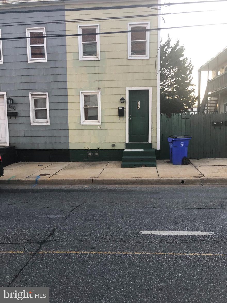 Nice 1BR, 1 Full Bath unit with 2 parking spaces in parking lot behind building.