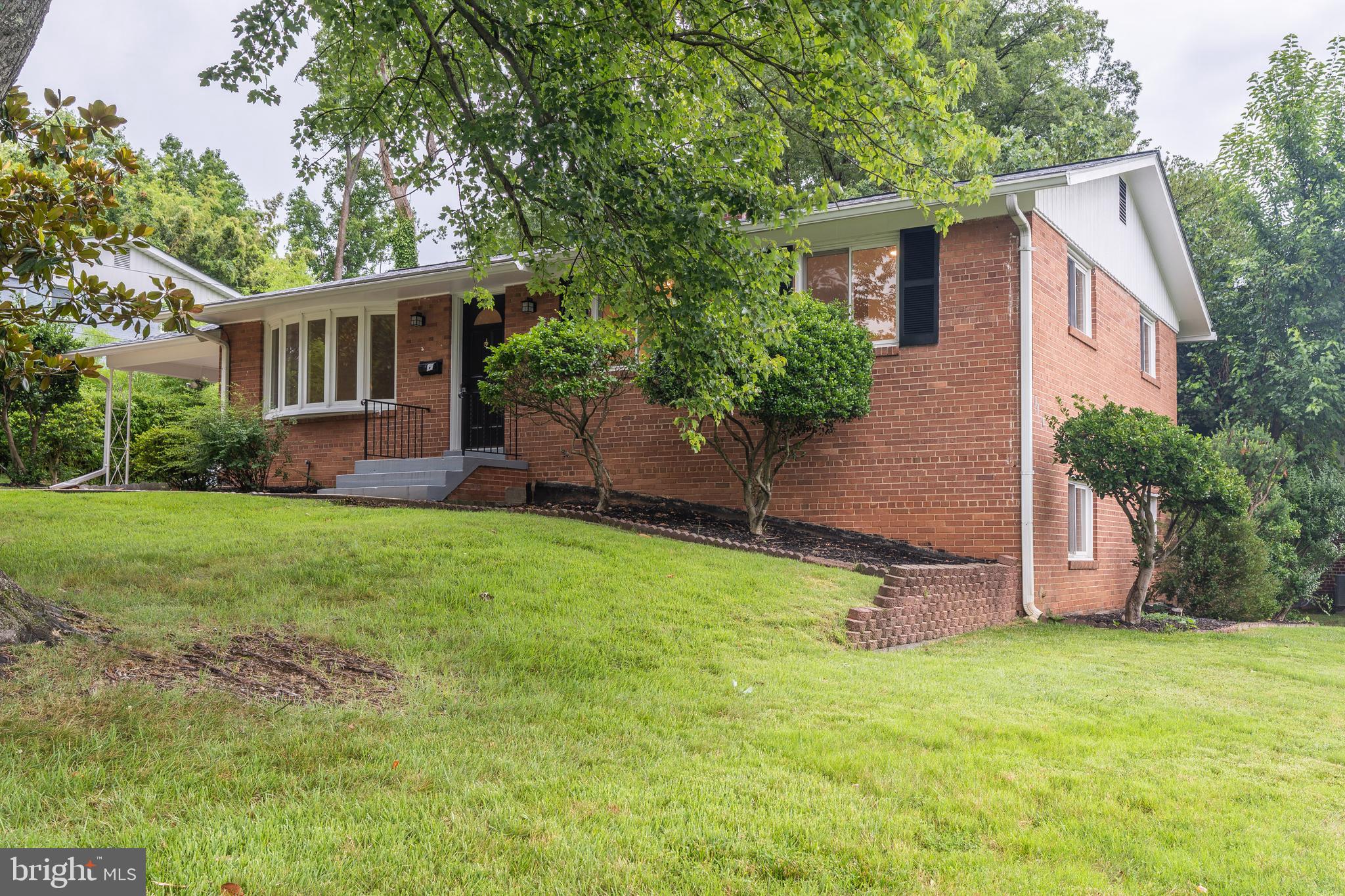 Like New! Stunning Fully Renovated Rambler in College Park Estates
Welcome to this beautifully updated three-bedroom, two-bath brick rambler, tucked away on a quiet, tree-lined street in the desirable College Park Estates community. Fully renovated in 2025, the home features a brand-new roof (2022), updated HVAC (2018), all windows replaced, brand new bathrooms & remodeled kitchen (2025) , refinished hardwood floors(2025), luxury vinyl plank flooring in the sunroom and basement (2025), and new light fixtures! The corner lot offers expansive views and plenty of extra parking.
Step into the bright Living Room, featuring a large bay window and gleaming hardwood floors that flow into the adjoining Dining Area, complete with new lighting. The rear
SUNROOM adds versatile living space with crown molding, a ceiling fan, and four large windows overlooking the backyard. Newly renovated, the stylish Kitchen includes new counters, white subway tile, ceramic tile flooring, open shelving, recessed lighting, and brand-new stainless steel appliances. A side door provides easy access to the driveway, carport, and lower level.
All three Bedrooms offer refinished hardwood floors. The Primary Suite includes a double-door closet and private En-Suite Bath with modern finishes and Kohler fixtures. The updated Hall Bath features a tub/shower combo, new vanity, and matching finishes.
The Lower Level, with brand new LVP flooring throughout, includes a spacious rec room with paneled walls and a charming corner bar with GE fridge, a full laundry area with washer/dryer and utility sink, and two flexible bonus rooms—perfect for an office, guest room, or gym. Extra storage and a passthrough area with HVAC complete the space.
Out back, enjoy a lush private yard with mature landscaping, a large hardscape patio ideal for entertaining or relaxing, and a custom built extra large shed for additional storage.
This move-in-ready gem is just minutes from the University of Maryland, with convenient access to DC, Baltimore, and Annapolis. Nearby, you’ll find scenic bike trails, Lake Artemesia, and local amenities. With extensive updates, great indoor-outdoor flow, and a prime location, this home is a rare find in College Park Estates.