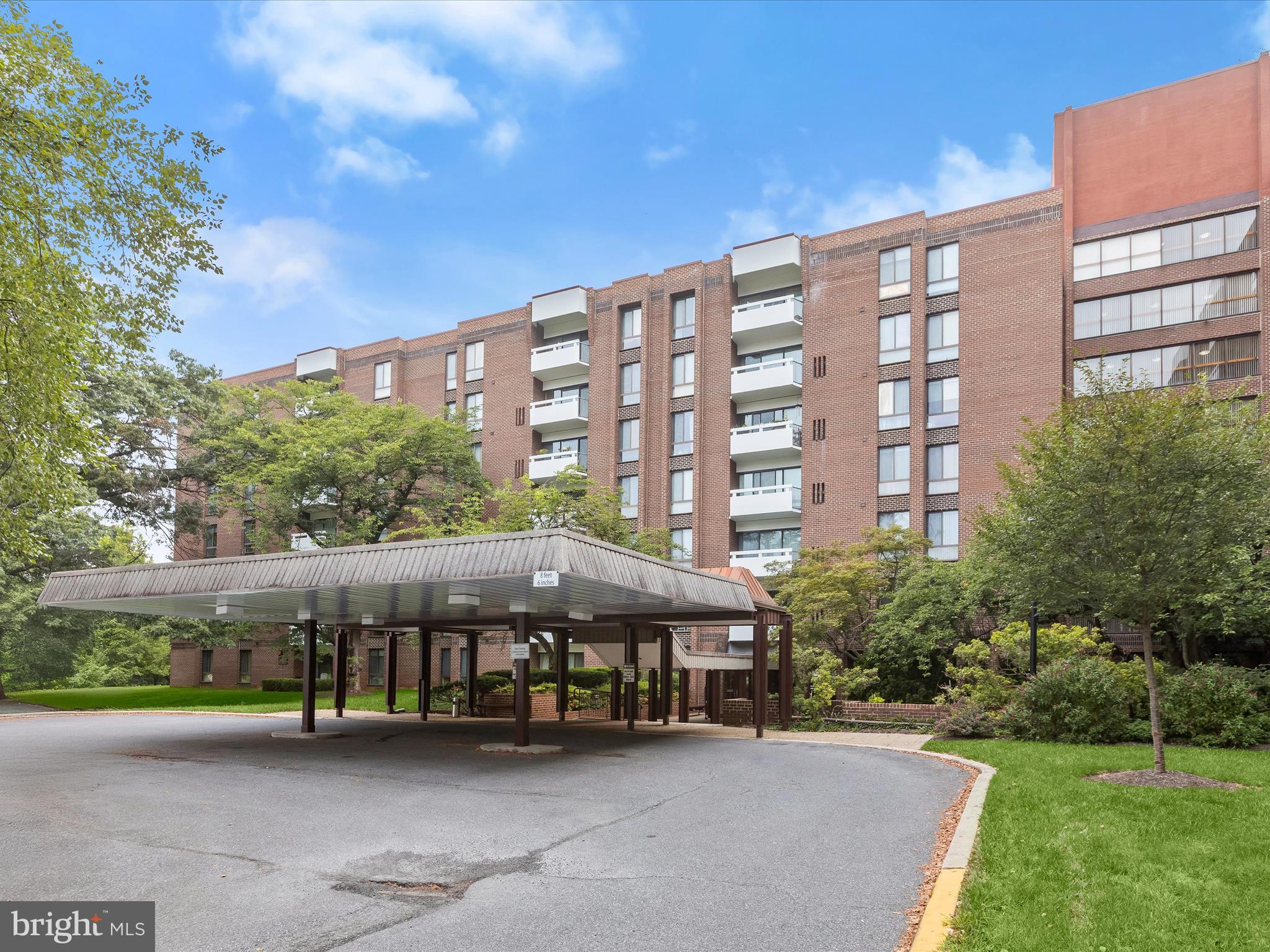 Introducing this spacious two bedroom, two bathroom condo on the fourth floor of the desirable 7 Slade building in the Suburban Oaks community. Inside, a generous living room opens to a private covered balcony through sliding glass doors, while an elegant formal dining room flows into a well-appointed kitchen featuring stainless steel appliances and 42-inch cabinets. The primary suite offers two walk-in closets, a vanity dressing area, and a private bathroom with a walk-in shower. A second bedroom includes built-ins, a walk-in closet, and easy access to the second full bathroom with a tub shower. Additional highlights include in-unit laundry, private gated parking, a doorman in the lobby, and an outdoor community pool. All utilities are included in the monthly condo fee. Ideally located in Pikesville with convenient access to 695, 795, shopping, dining, and public transit options. Some images have been virtually staged.