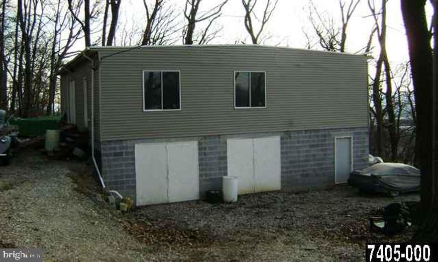 1.55 acre lot in Hellam Township  with 3600 s.f.  2 level garage. Garage built in 2005 has 200 amp electric service. There is an existing well on the property. Seller currently uses the property for auto repairs and parts storage. This is personal use and not a business use. Convenient location and many possibilities for this properties.