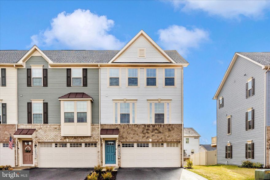 MOVE-IN READY END-UNIT TOWNHOME offering three fully finished levels, a 2-car garage, and a private fenced yard in the sought-after Hamptons Village of amenity-rich Lake Linganore. Built in 2022 and impeccably maintained, this sun-filled home features an open and inviting layout with over 2,000 sq ft of stylish living space. The gourmet kitchen is the heart of the home, showcasing quartz countertops, an oversized island with seating, stainless steel appliances, natural gas cooking, and a double wall oven—perfect for entertaining and everyday living. Durable and modern LVP flooring enhances the main level, while abundant windows fill the space with natural light. The finished lower level offers a walk-out and flexible space ideal for a rec room, home office, or guest area. Enjoy outdoor living on the maintenance-free deck overlooking the fenced yard, with common area surrounding the home—no mowing required.
Located in one of Lake Linganore’s most desirable villages. Walk to
school, enjoy access to multiple pools, lakes, trails, playgrounds, and community events, all just minutes from shopping, dining, and downtown Frederick. This beautiful end-unit is truly move-in ready—don’t miss it!