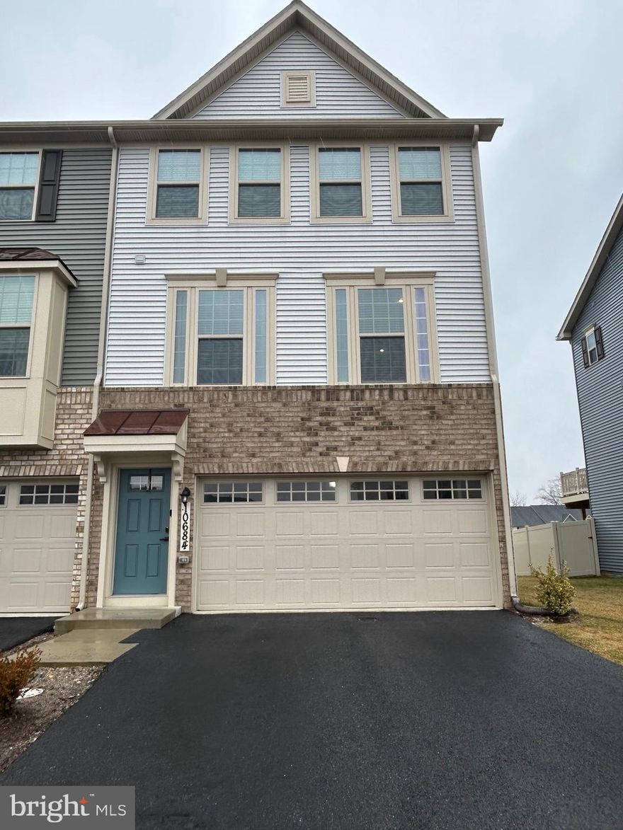 MOVE-IN READY END-UNIT TOWNHOME offering three fully finished levels, a 2-car garage, and a private fenced yard in the sought-after Hamptons Village of amenity-rich Lake Linganore. Built in 2022 and impeccably maintained, this sun-filled home features an open and inviting layout with over 2,000 sq ft of stylish living space. The gourmet kitchen is the heart of the home, showcasing quartz countertops, an oversized island with seating, stainless steel appliances, natural gas cooking, and a double wall oven—perfect for entertaining and everyday living. Durable and modern LVP flooring enhances the main level, while abundant windows fill the space with natural light. The finished lower level offers a walk-out and flexible space ideal for a rec room, home office, or guest area. Enjoy outdoor living on the maintenance-free deck overlooking the fenced yard, with common area surrounding the home—no mowing required.
Located in one of Lake Linganore’s most desirable villages. Walk to
school, enjoy access to multiple pools, lakes, trails, playgrounds, and community events, all just minutes from shopping, dining, and downtown Frederick. This beautiful end-unit is truly move-in ready—don’t miss it!