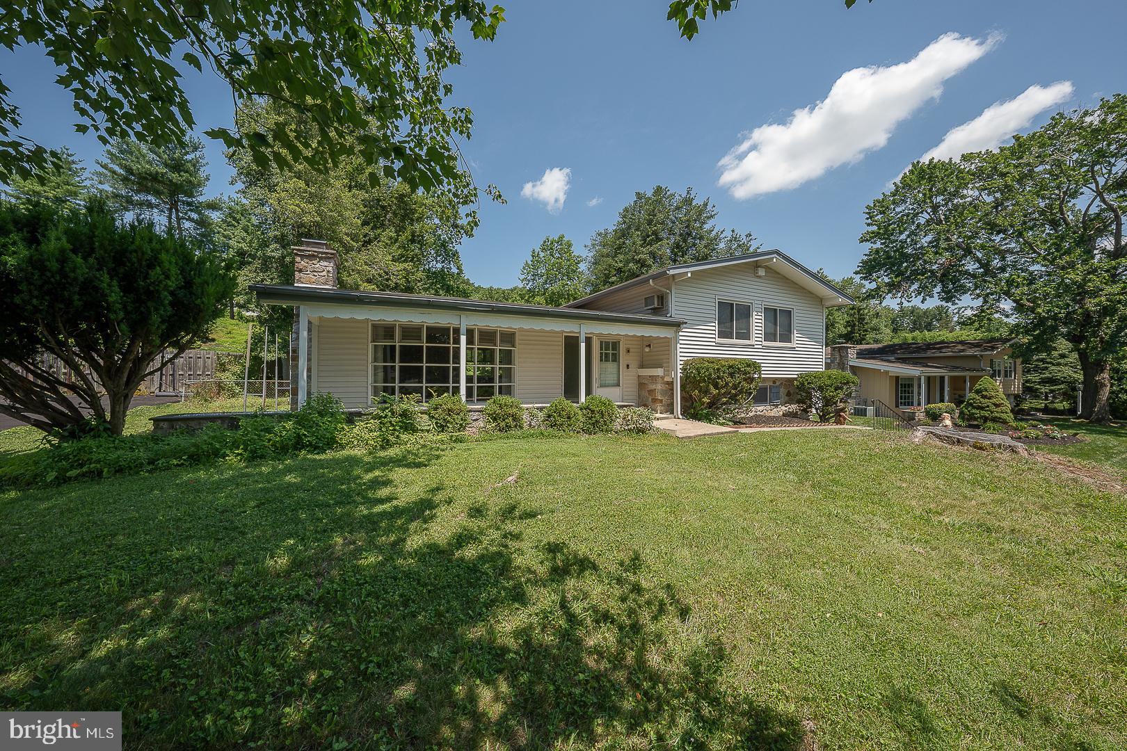 Welcome to this beautifully updated and bright contemporary split-level home, ideally located in the Gulph Mills section of King of Prussia. As you enter, you’re greeted by a bright and airy main level with soaring ceilings, stone fireplace, and an abundance of natural light. The spacious living room flows seamlessly into the formal dining room, both featuring gleaming hardwood floors. This open-concept space leads into the renovated kitchen, stainless steel appliances, ceramic floors, sleek granite countertops, and an abundance of cabinet and counter space. A sliding door off the kitchen opens to the slate terrace, perfect for relaxing or Alfresco dining. On the second level, you'll find three well-sized bedrooms, all featuring neutral carpet over hardwood floors. The spacious primary bedroom has an updated primary bathroom with walk-in shower. A full "Brady Bunch" bathroom with swing doors, and vintage finishes completes this level. The lower level family room with stonewall accent, has sliders out to the back yard , making outdoor living a breeze. This level also accesses the 2 car garage with automatic door openers. The unfinished basement offers excellent storage space, walk-in cedar closet or the potential to be finished for even more living area. The expansive, fully fenced backyard is a true retreat, featuring the two-tiered lawn. Recent updates include a newer roof (2024), a new hot water heater (2022), new french drain waterproofing system (2025). This home’s prime location places it just minutes away from the world-renowned King of Prussia Mall, a variety of dining options, scenic biking and running trails, Valley Forge State Park, Main Line, and easy access to all major highways.