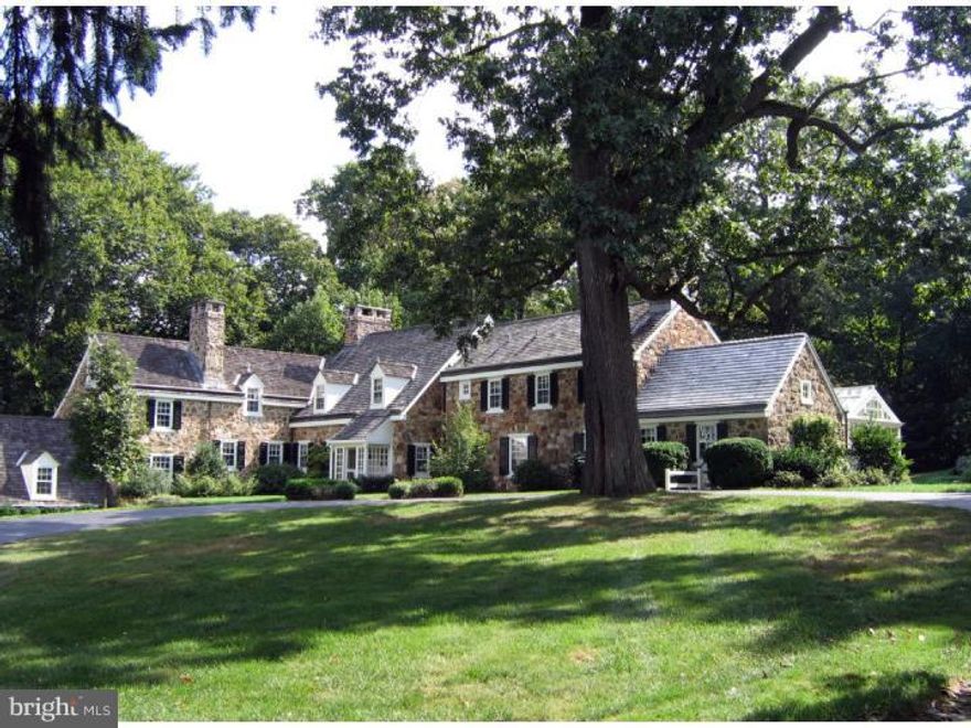 Built in 1942, this home by noted architect R. Brognard Okie is an important example of the region's best residential architecture. Situated on 4.95 ac, the pristine fieldstone colonial is approached through stone pillars down a long tree-lined drive backed by fields of green. Richard Buchanan (Archer & Buchanan) has carefully overseen renovations for the owners, ensuring unsurpassed craftsmanship & creating a home that exudes warmth & informality suited to today's lifestyle. Gracious formal rooms lead seamlessly to casual spaces for relaxing. Garden views delight from every window & the conservatory takes advantage of southern exposure while connecting the interior to the outdoors. The kitchen/family area is open, and flows to a stone patio encouraging lively gatherings. In summer, action moves poolside to a barn-like stone pool house designed by Peter Zimmerman. The master suite plus 4 en suite bedrooms are all updated. This home has been described as one of the most beautiful residences on the Main Line.