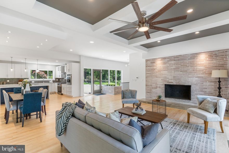 Contemporary living meets Mid-Century Modern! Fully renovated professionally with attention to every detail. While situated on one of the most sought after streets in Caves Valley, prepare to be captivated by the unobstructed and protected, picturesque views behind this newly renovated home. 
Retreat from the daily hustle and bustle, and enjoy the calm and peaceful setting inside and out. Feel the abundance inside as you step through the front door into the bright and spacious living area.
As you enter you are greeted with an expansive open floor plan with natural maple hardwood floors throughout, decorative ceilings and exposed brick with wood-burning fireplace. Entertain family and friends in the large and open dining area. Step into your gourmet kitchen featuring a large island with waterfall veined quartz counter, six-piece stainless steel appliance package with gas range, range hood, double oven, custom backsplash, tons of cabinet space and natural light. Bonus wine fridge and built in microwave can be found built into the beautiful kitchen island. A chefâs dream! Main level laundry and half bathroom for added convenience! The primary ensuite is spacious in size with recessed lighting, large walk in closet and access to your very own private deck! The primary bathroom features dual vanities and an oversized walk in shower with two shower heads including a waterfall showerhead! The second bedroom ensuite has an accent brick wall, walk in closet and bathroom with soaking tub and custom tile surround.  An additional bedroom for guests is the perfect place to relax.  The shared hall bathroom has dual vanities and a custom tile tub/shower combo! The finished lower level features a beautiful recreation room with another brick wood fireplace, additional bedroom and full bathroom with shower/tub combo. Never run out of storage in the unfinished storage space in the lower level!  Two sliding doors lead to the newly built deck to enjoy a cool summer night reading or enjoy a nice Summer BBQ overlooking the almost 1.5 acre private yard. The property has a new well, dual fuel HVAC systems and a tankless water heater for energy efficiency. Brand new roof, windows and sliders! Enjoy the quiet valley lifestyle minutes away from everything you would ever need. Conveniently located to Hunt Valley, Timonium, Pikesville, Owings Mills, Falls Road Corridor, and I-83.  This is the one you have been waiting for! Schedule your showing today!