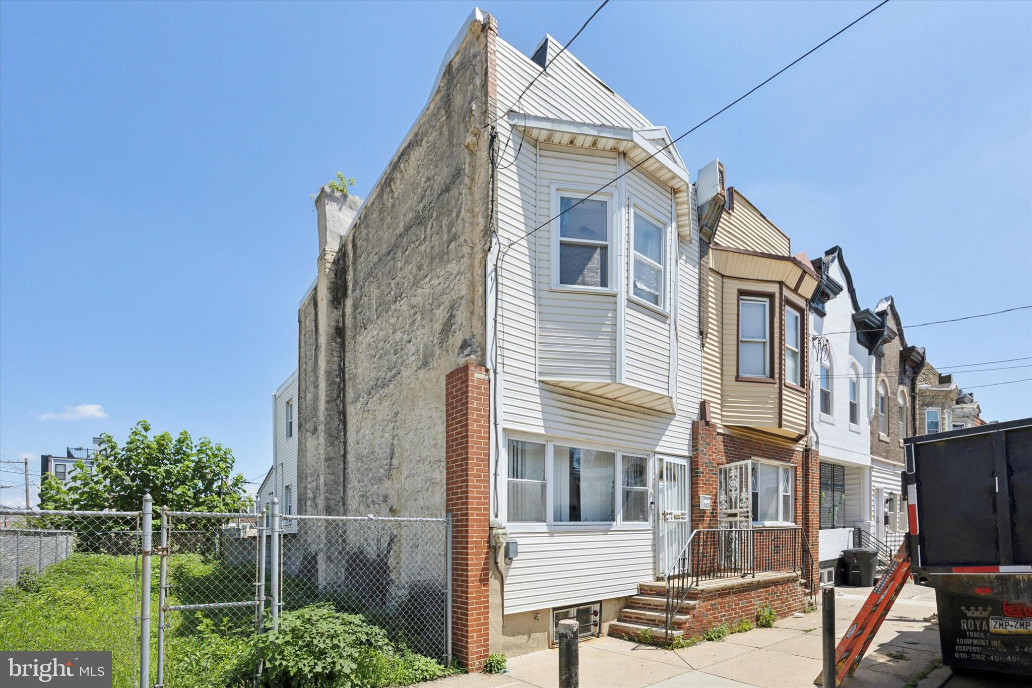 TWO PARCELS FOR SALE TOGETHER! This Grays Ferry home is on S. 29th St, just off the corner of Reed St and is currently attached on only 1 side. Lovingly-maintained by its long-time owner, move right in and undertake any cosmetic updates along the way to modernize. Plus, the second lot is directly behind for plentiful private parking (up to 6 cars!) or other use. The home's main level includes a small enclosed porch, followed by an open living space with plentiful room for a seating area and dining table beneath chandelier lighting. The spacious kitchen is at the back with the cooking area separate - perhaps open it up or reconfigure to create your dream kitchen! Upstairs, you'll find three carpeted bedrooms and tiled hall bath with tub shower. Additional features include unfinished basement with laundry area, central A/C, ceiling fans, and rear patio area for outdoor enjoyment. If you're home shopping in the area, be sure to put this home on the must-see list!