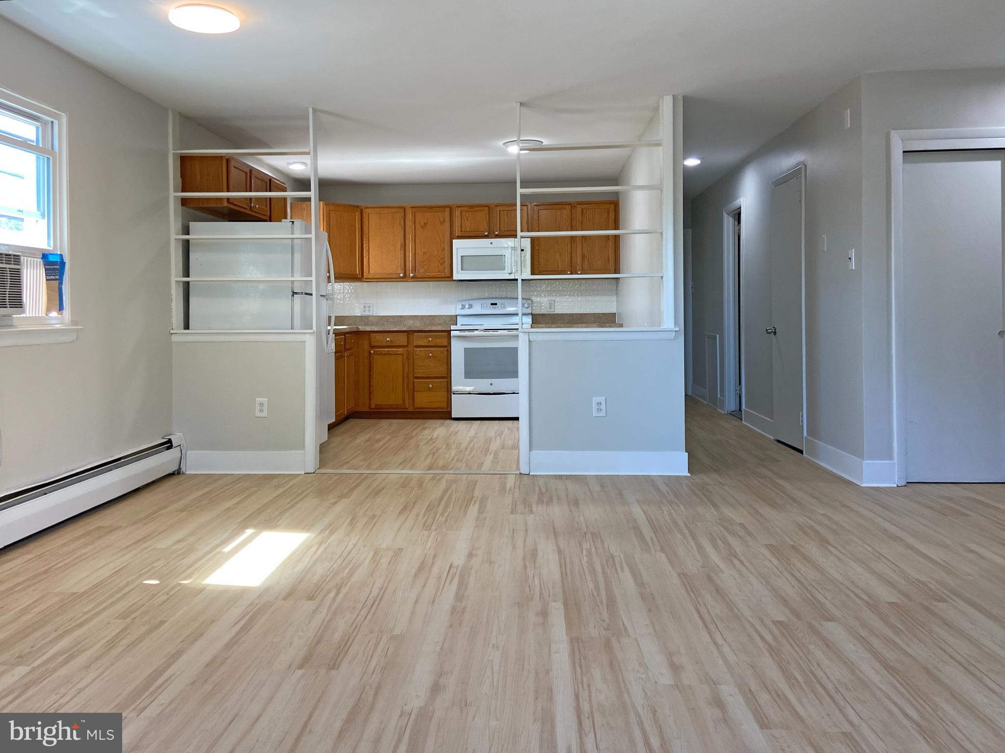 This charming 2-bedroom, 1-bath apartment, offers a fresh and inviting space to call home. Enjoy modern living with a built-in range, refrigerator, and dishwasher, all designed to enhance your daily routine. The newly installed luxury vinyl plank flooring adds a touch of elegance while ensuring easy maintenance. Nestled in a vibrant neighborhood, you'll find local parks, shops, and dining options just a short stroll away, perfect for leisurely weekends. With two dedicated parking spaces and a welcoming garden-style building, convenience is at your doorstep. Available for lease now. Tenant Only pays TV/INTERNET & ELECTRICITY! Landlord pays HEAT, Water, Heater Maintenance Contract, Lawn/Shrub Care, Sewer, Snow Removal, Trash Collection! Embrace the comfort and community of this delightful apartment, where every detail is designed for your enjoyment. Don't miss the opportunity to make this space your own!