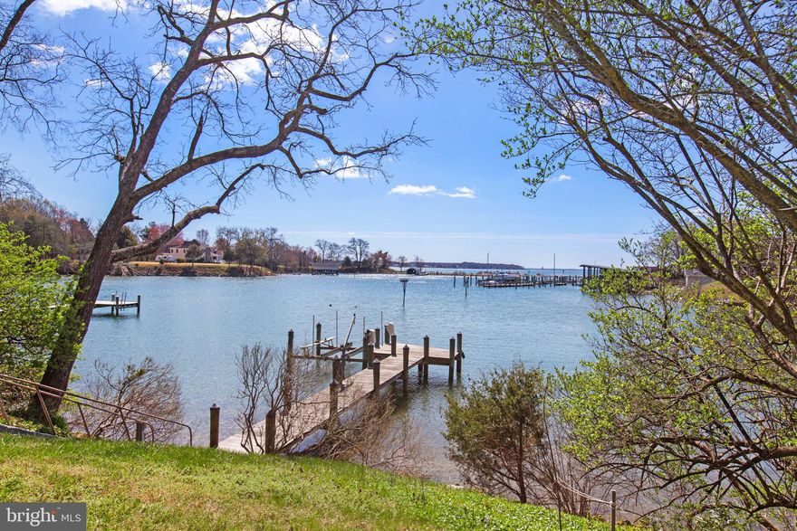 If you've been looking for Leonardtown waterfront, look no further! This exceptional .83-acre waterfront retreat on deep, protected Combs Creek offers breathtaking, panoramic views stretching across Breton Bay to the Potomac River. A rare and versatile offering, 40003 Tippit Road features TWO beautifully appointed dwellings, blending historic charm with modern comfort in a truly serene setting. The fully renovated circa-1900 farmhouse welcomes you with warmth and character, featuring 3 bedrooms and 2 baths. Inside, you’ll find a beautiful, updated kitchen, rich yellow pine tongue-and-groove flooring throughout the main level, and abundant natural light pouring in through new windows—many framing captivating water views from nearly every room. Thoughtful upgrades include a new 200-amp electrical service and an energy-efficient on-demand tankless water heater. Complementing the main home is the enchanting “Crossbreeze” studio—a light-filled, architecturally striking space with exposed beams, a wood-burning fireplace, full bath, kitchenette, and flexible sleeping area. With both upper and lower balconies, the studio offers its own private vantage points to soak in the expansive waterfront scenery. A brand-new roof adds peace of mind.  Outdoors, the property is equally impressive. The well-maintained shoreline is protected with rip rap and enhanced by a private dock complete with a 10,000 lb boat lift—perfect for boating enthusiasts. Nature lovers will appreciate the abundant wildlife, including ospreys nesting beside the pier. Lush landscaping and raised vegetable gardens create a tranquil, self-sustaining oasis, while a winterized pump house and state-of-the-art water filtration system support the well water system. Public sewer service adds additional convenience. Lovingly maintained and thoughtfully updated, this extraordinary property offers endless possibilities—whether as a primary residence, a multi-generational compound, or an investment opportunity with vacation rental potential. Experience the very best of Leonardtown waterfront living at this one-of-a-kind retreat.