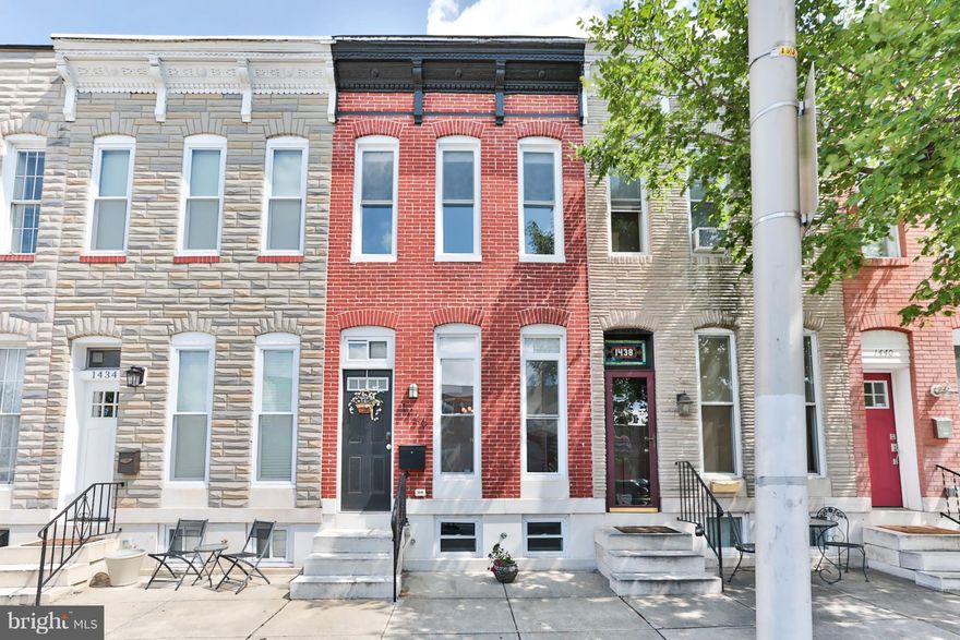 This gorgeous Locust Point home was completely renovated in 2014.The very large gourmet kitchen has custom cabinets and a light shade of granite.The house has coffered ceilings on the main level, a decorative fireplace, gleaming hardwood floors, exposed brick and a fully finished basement with full bath.Upstairs middle room makes the perfect office. Bathrooms on all levels!  Roof Deck!