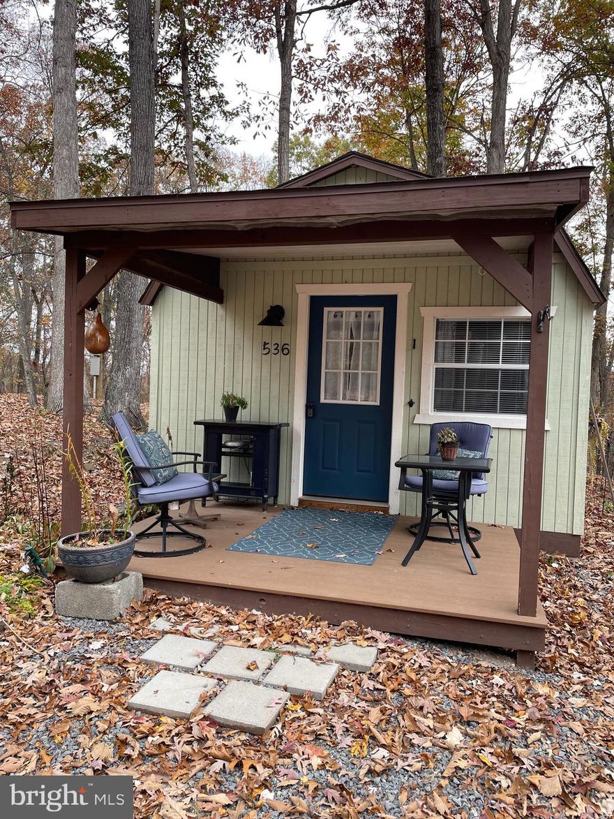 Custom built cabin in the foothills of Great Cacapon WV, just waiting for the new owners to enjoy as much as the current owners have.   This cabin has everything you need for your weekend getaway or just enjoy this cozy place while building your next dream home, which the utilities have already been extended for that.  All you need to do is bring a change of clothes and some food to make it nice. Internet is installed for your WI-FI phone and to stream movies.  Enjoy sitting around a campfire to the sound of nature.  If you have been thinking about making a move, then this is the move that has been waiting on you.  See additional docs for more information on this quiet and secluded place...