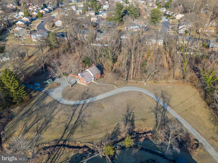 Opportunity is knocking—are you ready to answer? 

Welcome to 531 W Woodland Avenue, a rare opportunity to own 2.74 acres of scenic land in Springfield, Delaware County. This spacious split-level home offers endless possibilities, just waiting for your personal touch! The sellers have already started the transformation by removing carpets, stripping wallpaper, and professionally painting several rooms. Now, bring your creativity and make this home your own! Inside, you'll find a bright and airy living room, a formal dining room with hardwood floors, and an inviting eat-in kitchen. The lower level is perfect for entertaining, featuring gorgeous stone fireplace in the great room with a built-in bar, a private office or 5th bedroom, a full bath, and access to the outdoor deck and grounds. Entertain your family and friends on the massive deck and unique outdoor fireplace. The upper levels offer three well-sized bedrooms with hardwood floors and a full bath, while the top floor boasts a private primary suite with two large closets and an ensuite bath.  The massive walk up attic is perfect for all of your storage needs and who wouldn't smile at having the luxury of an attached 2 car garage! Don't miss the unfinished basement which is accessed from the garage as well.

Enjoy the privacy and beauty of nature while still being centrally located near major routes for easy commuting. Home is located in the Award Winning Springfield School District!  Don't miss this incredible opportunity—schedule your showing today!