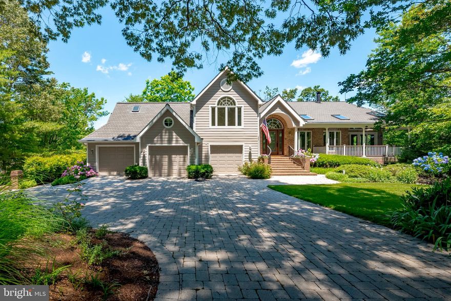 PARADISE POINT  magnificent deep water retreat on a peninsula with over 500 feet of waterfront and new bulkhead overlooking Mill Creek on the Magothy River.  A paver stone driveway with electric gate off the cul-de-sac leads to private setting featuring extensive hardscape and lush landscaping around the home. There is a welcoming staircase to front entry and views of the covered porch.  Inside find water views from every room.  The open floor plan, spacious rooms, vaulted ceilings, walls of windows and glass doors bring in light from every angle.  New Pella windows, hardwood and porcelain tile floors, fresh paint, window coverings and 3 new HVAC units make this home move-in ready.  A large gourmet kitchen with updated stainless appliances is a great gathering space and the dramatic, floating dining room reaches out to the waterfront with sweeping views.  There are 2 sets of French doors to the adjoining family/sunroom with wood-burning fireplace and sliding doors to front covered porch with skylights and ceiling fans.  Up a few steps is the spacious owner's suite with waterside balcony, large walk-in closet with dressing area and separate sitting room or home office.  Another bedroom and bath are on this level.  On the lower level a 2-story great room with wood burning fireplace, wet bar and atrium doors out to the pool and beyond to the waterfront.  There is an adjoining entertainment room accessed by 2 sets of French doors that has beautiful cherry built-ins and desk space.  Two additional bedrooms and baths are on this level   one of the baths also opens to the outside near the swimming pool.  A game room or exercise room also opens to the waterfront deck and there is a workshop or studio with windows out to the water.  3-car garages with epoxy floors are accessed from the front of the house along with a driveway around the side down to a 4-car garage and concrete path to near the water s edge and kayak launch. Carefree exterior of brick, Hardiplank, Azek, Trex and Timbertech.  The heated swimming pool has paver stone decking and stone steps to the fabulous Viking outdoor kitchen and dining area. A private 85-foot pier has protected deep water dockage (8-10 ft MLW) with 3 slips and 2 boat lifts.  This special home affords elegant indoor and outdoor living   a rare opportunity to have it all.