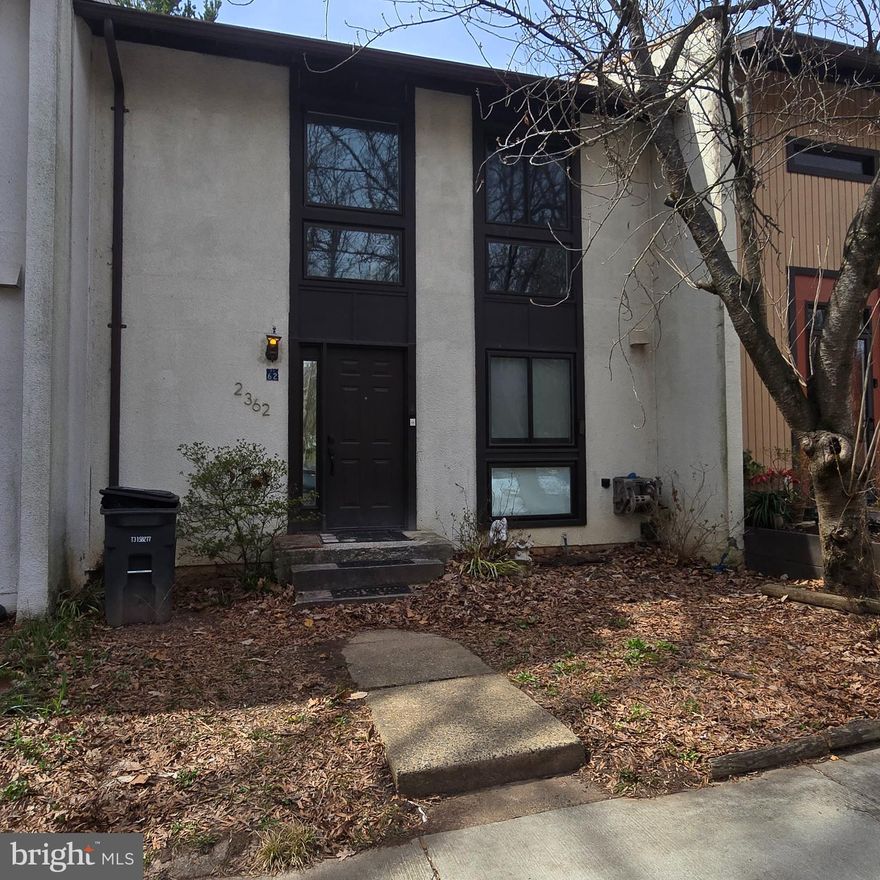 Home is in need of renovation and is sold "as is" - CASH only deal with quick settlement.  Located in the Pinecrest cluster of Reston. Three finished levels, upper level with 3 bedrooms & 1 full bath, Primary bedroom with balcony.  Main level hardwood flooring, separate dining room with balcony, Walkout lower level with 2 den/bedrooms, half bath and laundry room.  Fenced yard backing to trees. Two assigned parking spaces in front of house.  Updates within the past 6 years include roof, heat pump and windows.