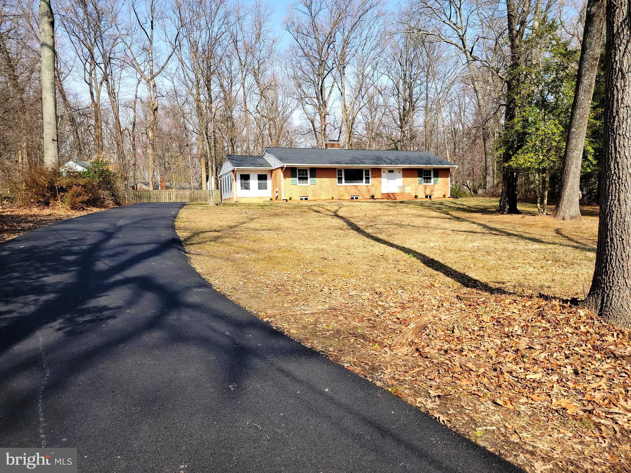 This beautifully, completely remodeled 3 bedrooms, 3 baths rambler with finished basement sits on an acre and is conveniently located. This home is much larger than it appears with a perfect allotment of space. Enter through the front door into a large light-filled living room. The gorgeous hardwood floors and electric fireplace make this space perfect for relaxing and entertaining. Off the living room is the light drenched Sunroom with LVP flooring. The kitchen has storage and counter space galore, new stainless-steel appliances, and a large stainless-steel sink. The primary bedroom has hardwood floors and ensuite primary bath. Two more bedrooms and full hall bath with a tub finish this level. From the kitchen, venture into the fully finished basement. The spacious rec room offers more opportunities to gather and entertain and also has a wood-burning stove. There is a full bath with a tub in the basement along with two bonus/flex rooms with closets that could be used as home offices, studies, or playrooms. A large laundry room finishes the lower level. Outside is a storage shed and plenty of parking on the newly paved driveway. New roof, new gutters, new washer, new dryer, new doors, new appliances and windows make this home worry-free for many years to come. New deep well in 2000 and new septic in 2015. Close to shopping, entertainment, parks, libraries and trails and the water. Easy commute to DC, NSWC Base, National Harbor, Pentagon, Alexandria, Arlington, and JBA.