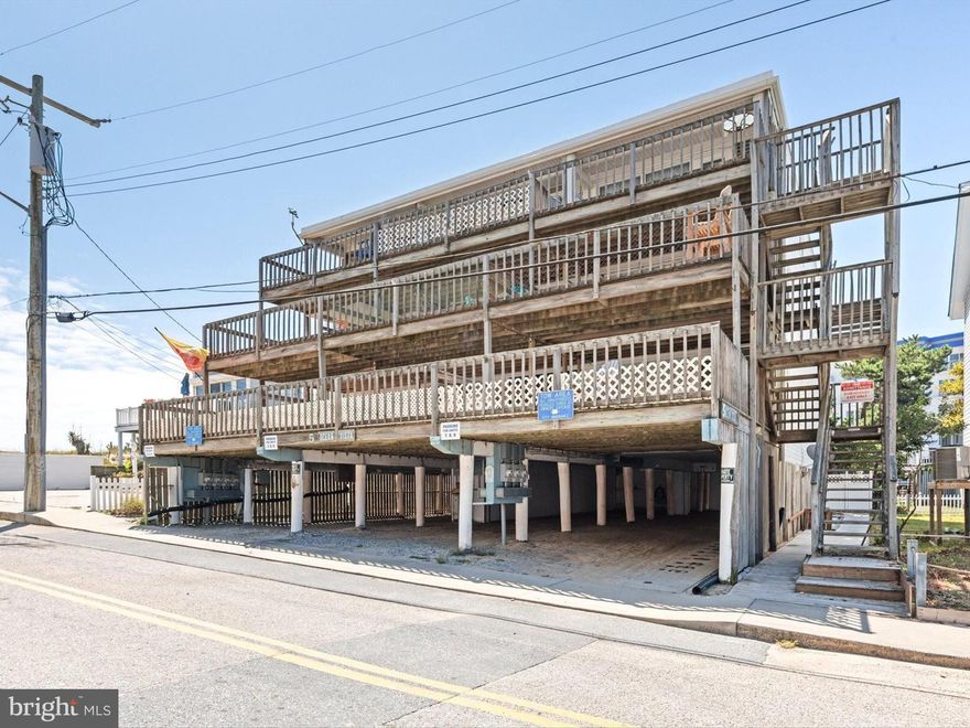This ocean block condo in the heart of Ocean City offers an unbeatable location just steps from the beach. The unit is being sold fully furnished, including a durable composite outdoor dining set, making it truly turn-key, just unpack and start enjoying your new coastal lifestyle. Bright white wood-beamed ceilings enhance the breezy, beach-inspired atmosphere throughout the open living area, which flows seamlessly into the kitchen and dining space. The kitchen features a breakfast bar, ample room for dining, and a ceiling fan for added comfort. Cool ceramic tile floors make cleanup after a day at the beach effortless, and in-unit laundry adds convenience.

Step out onto the expansive deck to soak in ocean views, relax, or entertain after a day in the sun. The one-bedroom, one-bathroom layout is both comfortable and functional, with plenty of natural light and thoughtful finishes throughout. 

Within the past several years updates included new kitchen cabinets, a tile backsplash, granite countertops, a newer living room A/C wall unit, LVP flooring in the bedroom, updated electrical panel, lighting, switches and outlets, replaced baseboard heaters, microwave, and TV. Fresh paint was completed in 2022, and the condo building received a brand-new roof in February 2022.

Parking is convenient with one tandem spot under the building and there is also a storage room included for all your beach gear. The unit carries a semi-annual ground rent of $90. This is a rare opportunity to own a beautifully updated, move-in-ready condo in a prime Ocean City location.