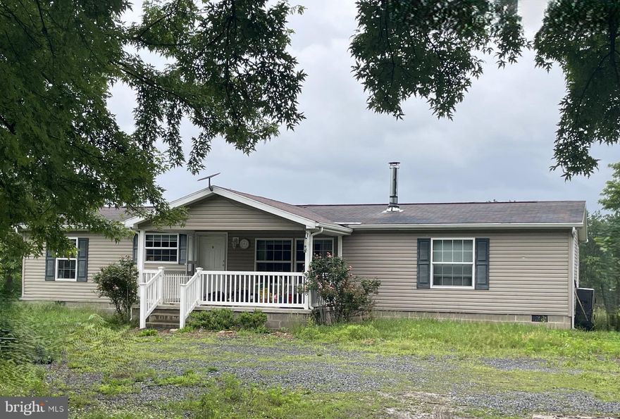 ONE LEVEL LIVING! Call today to see this 3 bed, 2 and a half bath ranch style double-wide on 3.37 acres. The home has a large kitchen/dining combo that has an island, plenty of cabinet space and nice big windows to enjoy the views. Each bedroom has a walk-in closet and the primary bedroom has an ensuite bathroom. The cleared yard is  mostly level. There are some sheds for storage. This is an opportunity to enjoy the country living where you can start a garden, grow your own food and bring your animals. The space outdoors is great for cookouts, entertaining, a fire pit, some horse shoes or cornhole.