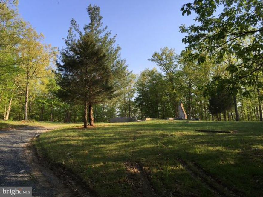 This lot had a 3-bedroom house on it which has been torn down.  Nice, private lot awaits your dream home.  Power at site, well and septic already installed.  No city tax, 5 minutes from shopping/restaurants.