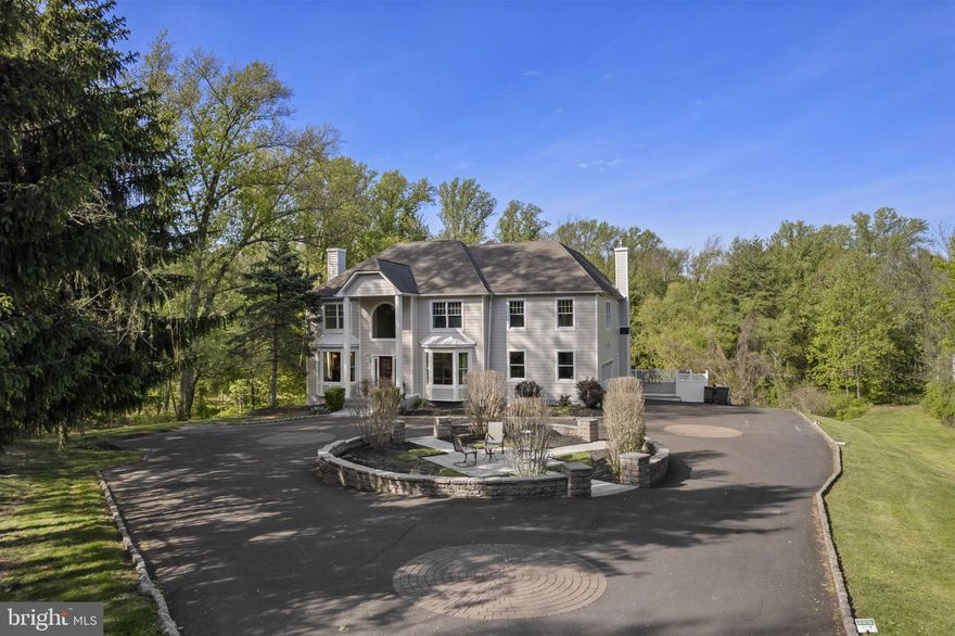 Welcome to your private oasis—perfectly positioned in the heart of convenience. Nestled at the end of a private road on a premium 3.24-acre parcel, this custom Colonial offers exceptional privacy, space, and timeless design. On a Flag Lot. 

Lovingly maintained and thoughtfully updated by the original owners, the home is surrounded by professionally landscaped grounds, a custom stone front patio, ambient lighting, and expansive decking that overlooks serene, wooded views. All surrounded on three sides by a Land Conservancy.  Private!

Step inside to a dramatic two-story hardwood foyer with staircase featuring new carpet runners. Just off the entry is a private home office with custom built-ins and glass doors. The formal living room with attractive mantel and  fireplace and elegant dining room—complete with wainscoting and chair rail—are ideal for both everyday living and entertaining.

The rear of the home' Main Level opens to a warm and inviting Family Room with fireplace, a Palladian window framing peaceful wooded views, and access to a convenient back staircase. The home is enhanced throughout with custom moldings and detailed millwork.

The updated kitchen features hardwood flooring, expansive countertops and tile, and a sunlit breakfast area with a custom sectioned wood built-in table, all flowing seamlessly into the family room and overlooking the expansive rear grounds. A powder room and a well-appointed laundry/mudroom with abundant cabinetry complete the main level.

Additional highlights include a 2+ car side-entry garage with epoxy flooring and updated doors, repaved driveway, and an elevated side deck for outdoor enjoyment.

Upstairs, you’ll find four spacious bedrooms, including a luxurious primary suite with sitting or workout area, custom moldings, and generous closet space. The en-suite bath offers ceramic tile flooring, a corner Jacuzzi tub, separate shower, dual vanities, and linen storage. Bedroom two includes a private bath, while bedrooms three and four share a hall bath. All bedrooms and baths have been freshly painted with new carpeting.

The full walk-out basement offers high ceilings, abundant natural light, and endless potential for finishing, along with direct access to the rear grounds.

Outdoors, enjoy your own private tennis court—recently resurfaced and ready for use—along with the peaceful natural setting that defines this property.

Recent upgrades include HVAC, hot water heater, custom front door, repaved driveway, and Hardie Board siding.

Located in the highly sought-after Northampton Twp and Council Rock School District, this exceptional home combines privacy, quality, and location in one truly special offering in Holland PA

Schedule your private tour today.