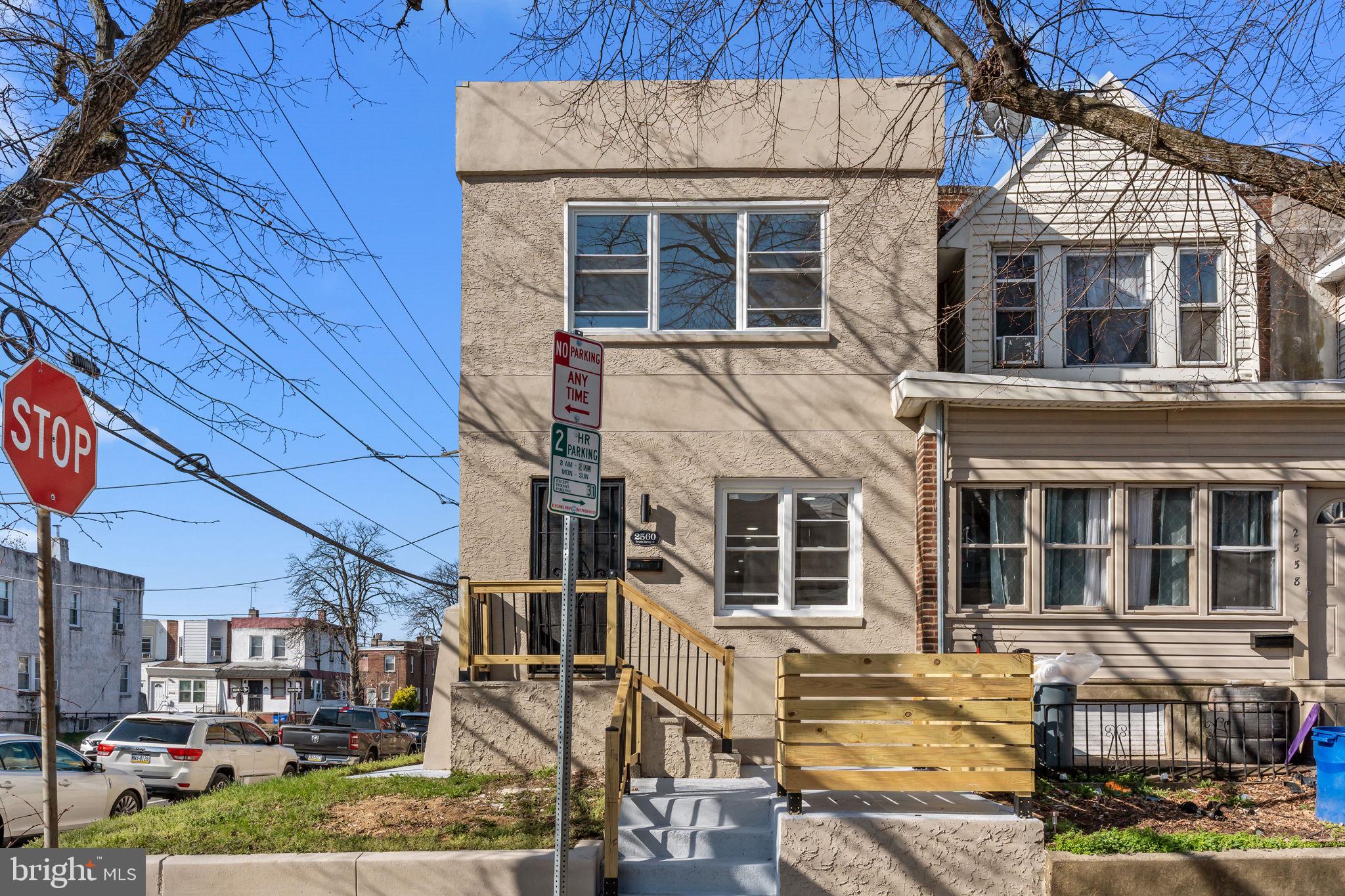 Welcome to 2560 S Dewey Street! A wonderful 4 bedrooms, 2 full bathrooms, move-in ready, open concept COMPLETELY RENOVATED corner row home with 2 car garage that's located in the desirable neighborhood of Southwest Philly. Upon entering the home you will notice an abundance of natural light, large plank floors throughout the whole house, a spacious bright living room flowing to an open concept kitchen that is a cook's delight. Kitchen featuring slow close cabinetry, stunning countertop and backsplash, all new stainless steel electric stove, built-in microwave, dishwasher, refrigerator and sink with garbage disposal. The kitchen has a side entry that goes to the spacious outdoor deck that's located over the two car garage. The entire house has recessed lighting throughout. The second level offers three large bedrooms, newly wide plank floors and a new guest full bathroom. Downstairs you will find a large finished lower level which is the 4th bedroom with a full bathroom with shower , laundry hookup and private outside side entrance. The house is quip with a NEW HVAC system, hot water tank and there's a two car garage. Centrally located and just minutes from Center City, SEPTA, regional rail, numerous shopping, restaurants, entertainment venues, schools, universities and the park. Schedule your visit now before this property becomes someone else's dream home!