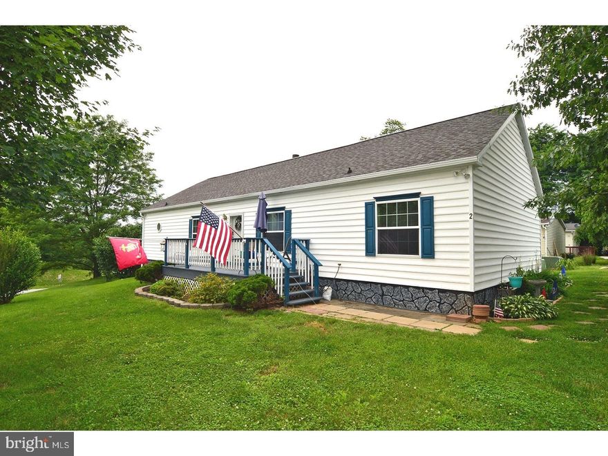 Welcome to 2 Buck Ct!  Built as a model home, this double wide, located in the Deer Run mobile home park, has a lot to offer, from the large corner lot to the home itself which has a spacious kitchen and living room! The owners just installed new wood veneer flooring in the living room, hall and bathroom. The master suite has a walk-in closet with access to the full attic, a whirlpool tub and walk-in shower. The spacious laundry/mud room provides additional storage. The full attic is a rare find with this type home and is the answer for additional storage needs. This property offers affordable living with all the modern convenience