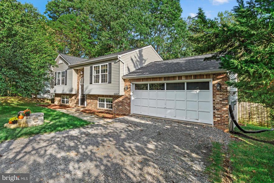 Welcome to Your New Oasis at 10029 Windridge Drive!
Nestled on a peaceful cul-de-sac within the Stonemill subdivision, this beautifully updated split-level home offers the perfect blend of comfort, style, and convenience.
As you enter, you'll be greeted by an inviting open floor plan that seamlessly connects the living spaces. Upstairs the Living Room welcomes you with an abundance of natural light streaming in through its generously sized windows.
Adjacent to the Living Room, the Dining Room beckons, easily accommodating a large dining table. Glass doors lead you to a spacious deck that invites al fresco dining and relaxation, overlooking the expansive backyard.
The kitchen is equipped with stainless steel appliances, sleek granite countertops, and elegant tile flooring, it's the perfect space to prepare delicious meals and create lasting memories. The kitchen's design seamlessly integrates with the Dining Room, making serving and hosting a breeze.
The main level also features the master bedroom and a full bathroom for your convenience.
Descend to the lower level and discover a spacious den – an ideal area for unwinding, movie nights, or a home office. Additionally, you'll find two generously sized bedrooms and another full bathroom on this level, making it perfect for family, guests, or even a dedicated home gym. The washer/dryer hookup adds extra convenience to your daily routine.
Access the two-car garage directly from the lower level, making it effortless to come and go, rain or shine.
Location couldn't be better – you're just moments away from shopping, dining, Interstate 95, and the VRE, making your daily commute and errands a breeze.
Don't miss this incredible opportunity to make 10029 Windridge Drive your forever home. Schedule a showing today and let your dreams take shape in this remarkable property!