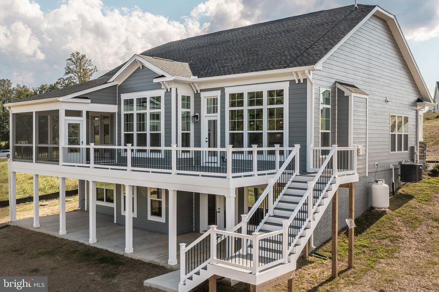 MOVE-IN-READY WATERFRONT HOME AT LAKE ANNA!!
Presenting the Banyan Floor Plan by Evergreene Homes 

Welcome to lakeside luxury at its finest! This stunning craftsman style home with Hardi-Plank siding is perfectly situated on a little over 1 acre in the prestigious Rock Island Landing community on the private side of Lake Anna. With long, breathtaking waterfront views and over 130 feet of pristine shoreline, this home offers the ultimate in comfort, elegance, and outdoor living. Spanning 3,800 beautifully finished square feet, this thoughtfully designed home features 4 spacious bedrooms and 4 full bathrooms, offering the perfect blend of privacy and functionality. Main Level Highlights include an open concept design with vaulted ceilings and a cozy fireplace, ideal for year-round enjoyment of the stunning lake views. Gourmet kitchen and living area that flows seamlessly to your composite deck, including a screened-in porch for peaceful relaxation. A Primary suite with private deck access, luxurious en-suite bathroom with ceramic tile, frameless glass shower, and a large walk-in closet! Additional guest bedroom and full bath for visitors or home office needs. The Walk-Out basement is expansive with direct lake views, custom wet bar and Island that is perfect for entertaining, a concrete patio that extends your living space outdoors, and two additional generously sized bedrooms and two full bathrooms. Down at the shoreline you will find a completed fishing pier! Take a short golf cart ride to your assigned covered boat slip so you can enjoy the lake even more! Whether you're looking for a full-time residence or a luxury lakefront retreat, this home is a rare opportunity to enjoy Lake Anna living at its best.

10-Year Warranty / Builder Contract Required