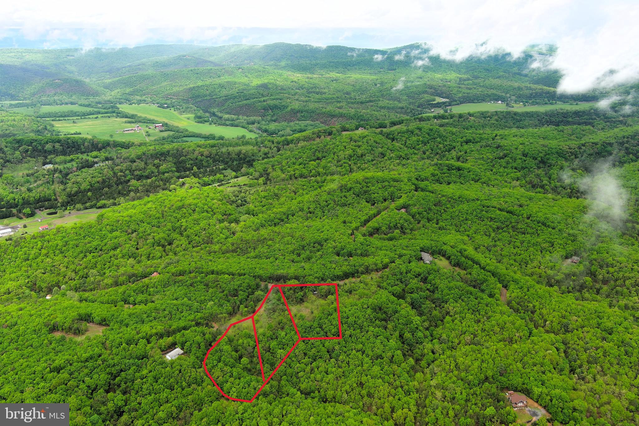 BREAKING NEW GROUND.....NEARLY 7 ACRES OF PRISTINE FOREST COMPRISED OF 3 ADJACENT LOTS THAT'S READY TO BUILD. BRAND NEW WELL, SEPTIC & DRIVEWAY INSTALLED AT DESIRABLE BUILD SITE OFFERING MOUNTAIN VIEWS. ALL THAT NEEDS DONE TO MAKE THIS LOT FULLY FUNCTIONAL IS TO INSTALL ELECTRIC SERVICE AND PUT A PUMP IN THE WELL.....ELECTRIC ONLY 100 FT FROM BUILD SITE. BRING YOUR PLANS AND START BUILDING! LOCATED IN CRYSTAL VALLEY ESTATES, A WELL MAINTAINED PRIVATE COMMUNITY THAT WAS DESIGNED AS A WILDLIFE SANCTUARY, WHERE NATURE CAN BE ENJOYED QUIETLY. NO HUNTING, SHOOTING OR ATV'S ALLOWED. THE PERFECT LOCATION FOR THOSE SEEKING THE MOST PEACEFUL OF SETTINGS. BRING FRIENDS OR FAMILY MEMBERS TO BUILD ON THE ADJACENT LOTS. THE HEAVY LIFTING AND HEADACHES OF GETTING THIS LAND READY TO BUILD ARE OVER, 25K WORTH OF INFRASTRUCTURE COMPLETE! BUILD BIG OR BUILD SMALL, ONLY 480 SQ FT MINIMUM FOR THOSE LOOKING TO DOWNSIZE. GET THAT WAY OUT THERE FEELING WITHOUT BEING WAY OUT THERE....ONLY 5 MILES FROM DOWNTOWN ROMNEY. STEP # 1 TO LIVING THE DREAM.....GET THE LAND!