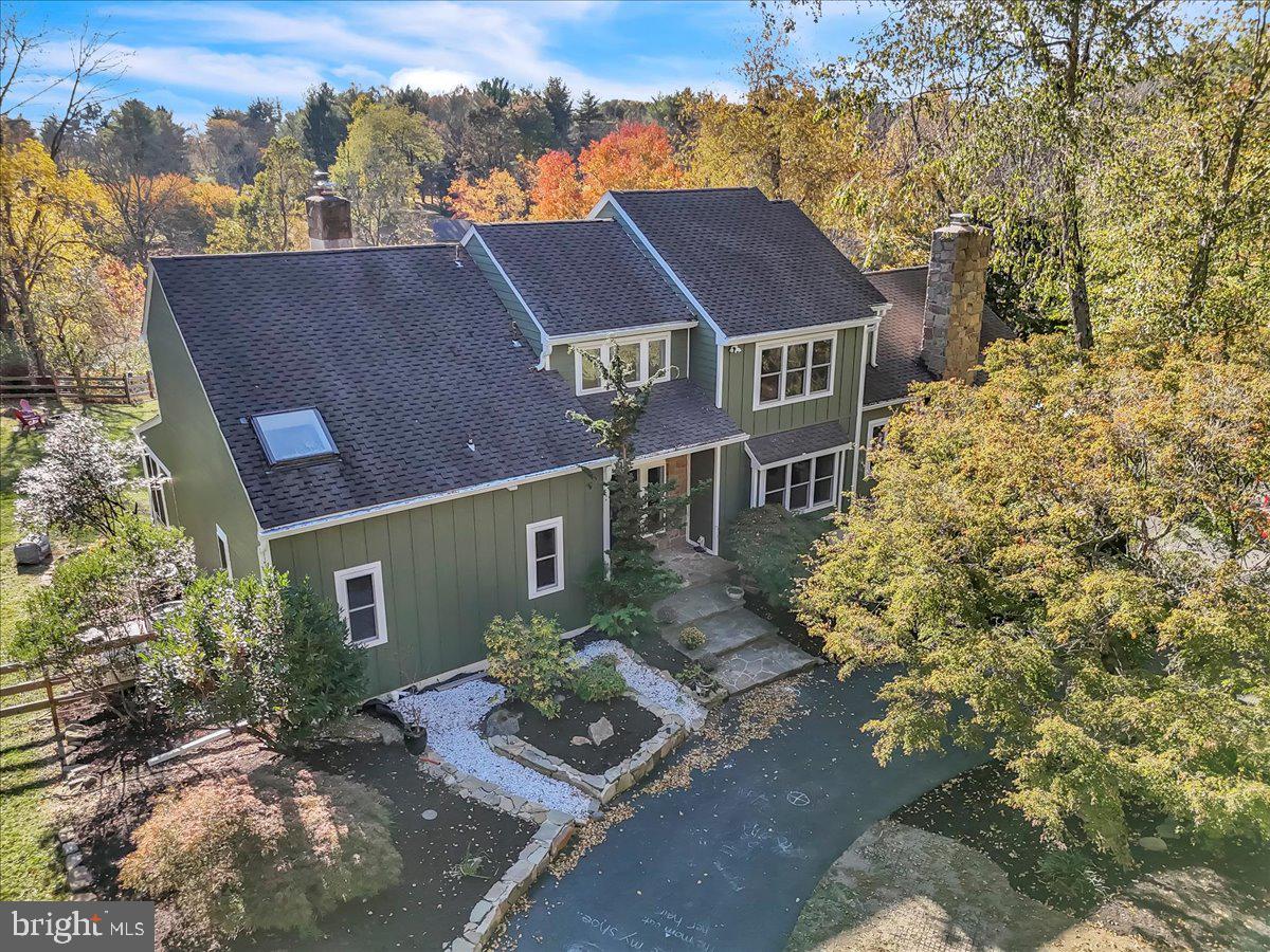 A rare opportunity awaits with this one-of-a-kind, show-stopping home that masterfully blends luxury and privacy on over 2 meticulously landscaped acres with views that are simply unparalleled! Overlooking two picturesque ponds, 116 Harvey Ln is designed to amaze with its setting, extraordinary features, and high-end upgrades throughout. Pride of ownership shines in every detail of this heavily updated property. As you approach, you’ll be captivated by the all-new LP Smartside siding, new windows, 50-year shingle roof, and custom landscaping that frame this stunning home. Out back, you’ll find a custom-designed saltwater pool and spa complete with two Baidu swim jets, an expansive sun shelf, and an automated cover for convenience. Relax on the multi-level, 500 sq. ft. synthetic deck that overlooks the pool and ponds, enjoying what may be the best views in Delaware County! Inside, the attention to detail is remarkable, offering a perfect layout for entertaining. The main level features wide plank engineered hardwood floors and large windows that capture breathtaking views from every angle. The custom kitchen is a chef’s dream, boasting new, high-end cabinetry, countertops, and upscale appliances, along with a hidden pantry that will quickly become a favorite feature. The primary suite on this level opens to a sunroom overlooking the stunning rear landscape and includes an en-suite bath with a soaking tub, walk-in shower with custom tile, double-sink vanity, and walk-in closet. This floor also includes a formal dining room with a stone-front fireplace, a spacious family room with vaulted ceilings, breakfast nook, main-floor laundry/mudroom, a half bath, and skylights throughout. The second floor offers a second primary suite with an en-suite bathroom, vaulted ceilings, skylights, and a walk-in closet, along with two additional well-appointed bedrooms and an upgraded full hall bath. The finished basement features a walk-out to the backyard, a half bath, and ample space for storage, workshop, and utility needs, along with inside access to the attached 2-car garage. All of this in the award winning Unionville- Chadds Ford School District! A home of this caliber doesn’t come on the market often—don’t miss this unique chance to own a piece of paradise. Schedule your private tour today!