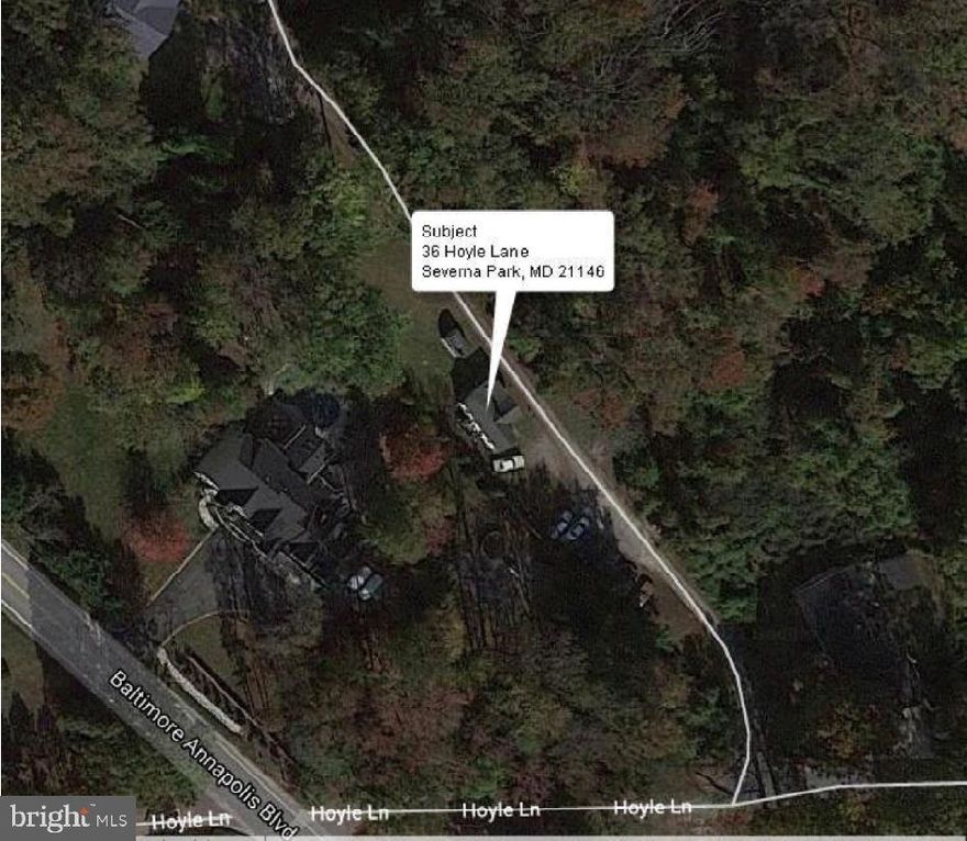 VALUE IS IN THE LAND Potential for total tear-down and new construction or to construct a modular home on the existing foundation. Avoid most impact fees by documenting existing structure for new permit. Existing Well, Existing Septic System, and Electric already to site. Property located on a private .77 acre lot, within 10 minutes of Annapolis, 30 minutes of BWI, NSA, Baltimore, and 2 miles from many major stores. SOLD AS IS