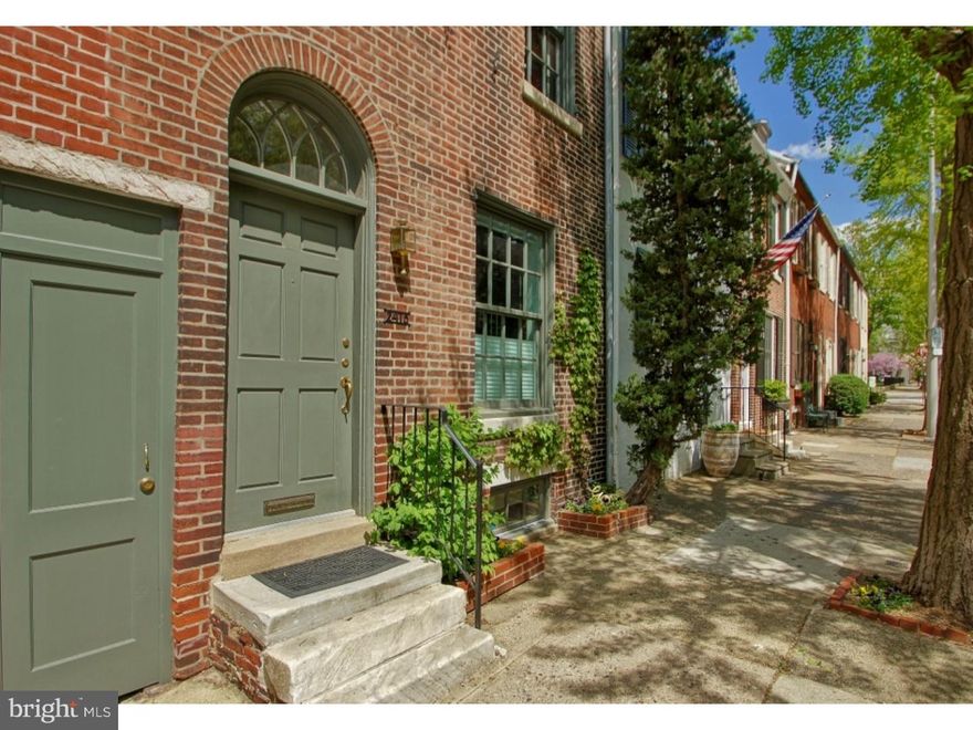 Stunning architect's renovation with 60 foot garden on highly sought after Fitler Square block.  Eat-in kitchen has custom built cabinetry (with under cabinet lighting), slate flooring, stainless backsplash, granite counters, Sub-Zero refrigerator, as well as Viking stove, hood, and dishwasher. Bright and open living and dining room with 10' ceilings, recessed lighting, and a wood-burning fireplace. Floor-to-ceiling French doors open to private double-lot garden that includes recently installed blue stone patio, planters, and 2nd patio in rear. Amazing one of a kind outdoor sanctuary in Center City with access to Panama Street and could provide easy access and storage for motorcycles, bikes, etc...  The lower level is designed and finished as a high-end multi-purpose suite.  The custom built-in shelving, cabinets, wine cellar, and Murphy bed provide excellent use of space and well hidden storage. Beautiful exposed wooden beams.  Full bath with frameless glass surround shower, Grohe fixtures and subway tile. The second floor provides a spacious and bright front bedroom and a rear bedroom with two large closets, built-in shelving and French doors overlooking the incredible outdoor space.  This level also has a bathroom with double vanity granite counters and slate flooring.  3rd floor master suite (currently being used as a family room) offers a renovated bathroom with vaulted ceilings, full subway tile surround, and frameless glass shower. Flexible space could be used as two office nooks or additional closets.  Rear deck with stunning skyline views, cedar plank flooring, and steel hand rails.  Designed and built by well know architect Brett Weber, this home features hardwood floors (finished on-site), recessed lighting, high ceilings, Grohe and Kholer fixtures throughout. Steps from Fitler Square, Schuylkill River park, Tria, and Fitler Dining Room.  A short stroll to UPENN, CHOP, Rittenhouse Square, 30th Street Station and all of Center City. Seller offering 1-year pre-paid PARKING at 22nd and Pine.