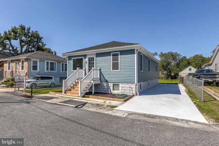 Absolutely gorgeous renovated home - done top to bottom with high-end finishes.in water-oriented community. You don't have to lift a finger except to move in.   New roof, siding, windows, doors, gutters, soffits, flooring, subflooring, appliances, white cabinets, granite & ceramic tile.  New wood-look laminate throughout.  6-panel doors.  Partially finished basement - dry wall.  Floors are painted concrete.  Upgraded electric and plumbing.  All 3 bedrooms are on the main floor.  Mudroom/Laundry on main level with entry from rear door.  New deck & stairs with vinyl railing.  View with access to Jones Creek so bring your boat/canoe/kayak or whatever & launch from your backyard.