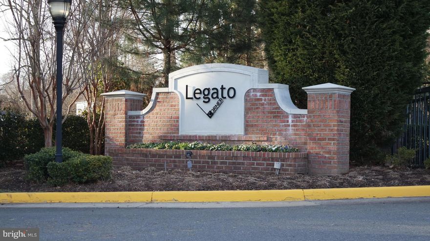 Move In Ready Condo in gated Legato Corner community.   Pergo Flooring, huge balcony, built in shelving and desk area.  Walk in closets, plus a "NEST" wifi thermostat.  Granite counter top, Stainless Steel Appliances, W/D in unit. 1 assigned parking space.  Near Fairfax Corner, Wegmans and more! Resort like pool & gym in gated community.