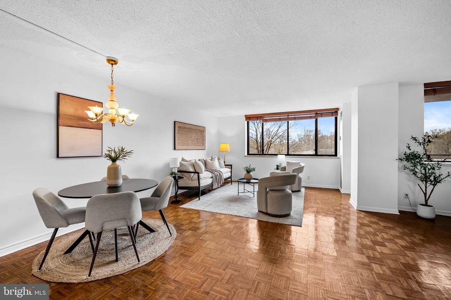 Freshly painted 1 bedroom 1 ½ bath condo in the highly desirable Harper House – Cross Keys’ luxury high-rise building offering secure, care-free living with the support of a 24/7 doorman and front desk attendant. This open concept floor plan features a kitchen with stainless steel appliances & tile floor, a combined living room/dining room, plus a bonus space perfect for a home office area or den. Just off the living area you’ll find a lovely north-facing balcony – accessible from both the living room and the bedroom – overlooking an expanse of mature trees and the nearby pool and village clubhouse. A spacious primary bedroom – accessed via a separate hall with large double closet -- features an en suite bathroom and dressing area/closet space. A convenient half bath in the entry hall - perfect for guests - contains the in-unit stackable washer and dryer.

Condo fees include electricity, water, a designated garage parking space & storage unit. Residents enjoy access to a host of amenities, including three community pools and a clubhouse, ideal for social gatherings or relaxation. The Village of Cross Keys is not just a location, it's a lifestyle that includes a lively community hub complete with an array of shops, delightful restaurants and cafes, all just a short stroll away. A short distance from I-83 with easy access to both northern and southern destinations, this is an excellent location for commuting or exploring Baltimore’s cultural scene.