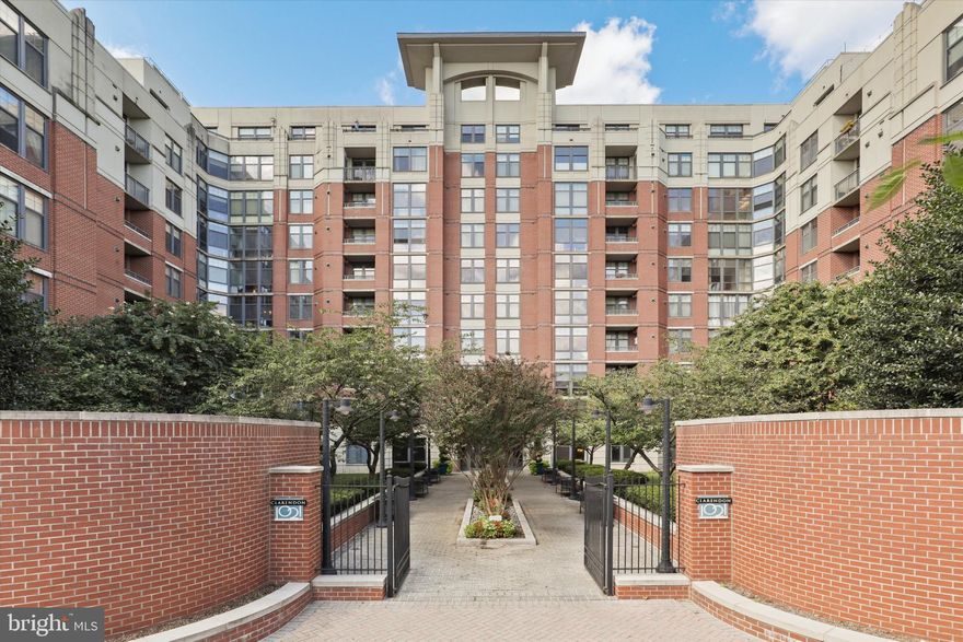 Experience elevated living in this sophisticated 1 bedroom + den, 1 bathroom residence in the heart of vibrant Clarendon. This impeccably designed home boasts an open-concept floor plan, rich hardwood flooring, and a gourmet kitchen featuring sleek stainless steel appliances, 42" cabinetry, and luxurious granite countertops. Seamlessly connected to the kitchen, the expansive living and dining area creates a perfect flow for both entertaining and everyday living. Sunlight pours in through large windows, highlighting the home’s airy design and offering ample space for a full dining table as well as generous seating. Whether hosting guests or enjoying a quiet evening at home, this inviting space effortlessly combines comfort and elegance. Retreat to the serene bedroom with immaculate carpeting and wake up to breathtaking city views, also enjoyed from your private balcony. The versatile den offers the perfect space for a home office or stylish guest retreat. For ultimate convenience, this residence includes in-unit laundry and rare privacy with only one adjoining wall, no units above, and no shared walls in the bedroom. The building’s resort-inspired amenities take luxury to the next level. Lounge by the rooftop pool with a cocktail in hand while soaking in panoramic views of the Capitol and Washington Monument. Host unforgettable evenings with friends at the rooftop grills and dining tables, or unwind on plush outdoor sofas as the sun sets over the city skyline. Stay active in the state-of-the-art fitness center, and entertain in style in the elegant party room every detail designed for a life of comfort, convenience, and sophistication. Set within one of Arlington’s premier communities, you’ll be just steps from world-class dining, boutique shopping, and the Metro. This is urban living at its finest where style, comfort, and location converge.