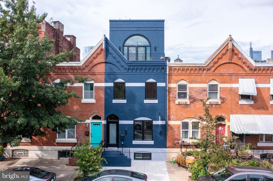 Welcome to this handsome townhome, thoughtfully re-imagined with unique designer details never before seen in Graduate Hospital. Offering four (4) bedrooms and three (3) bathrooms as well as three (3) outdoor spaces, this home has all of the features and amenities you’re looking for, and more.  

The spacious kitchen boasts Viking appliances, waterfall island countertops and top of the line UltraCraft cabinetry. Sun-soaked living space and floating, glass-cased stairs provide a bright and airy living level perfect for entertainment. Moving from the living room through your kitchen will bring you to a large dining space, which opens up into your private rear yard equipped with an elevated deck and dedicated gas line for outdoor grilling. The preserved character of the exposed, painted brick flowing up the stairs coupled with the contemporary finish selections create a unique and inviting space. 

The primary suite on the top floor is one of a kind. Where else will you find a built-in wet bar, private terrace, and a secondary floating, glass-cased stair to your expansive rooftop deck all in one? If these features weren’t enough, the primary suite also includes a complete walk in  California Closet, soaking tub, and marble tiled shower with a bench and Kohler Purist fixtures. 

Claim your piece of history with this beautiful and unique renovation brought to you by Stamm Development Group right in the heart of Graduate Hospital!