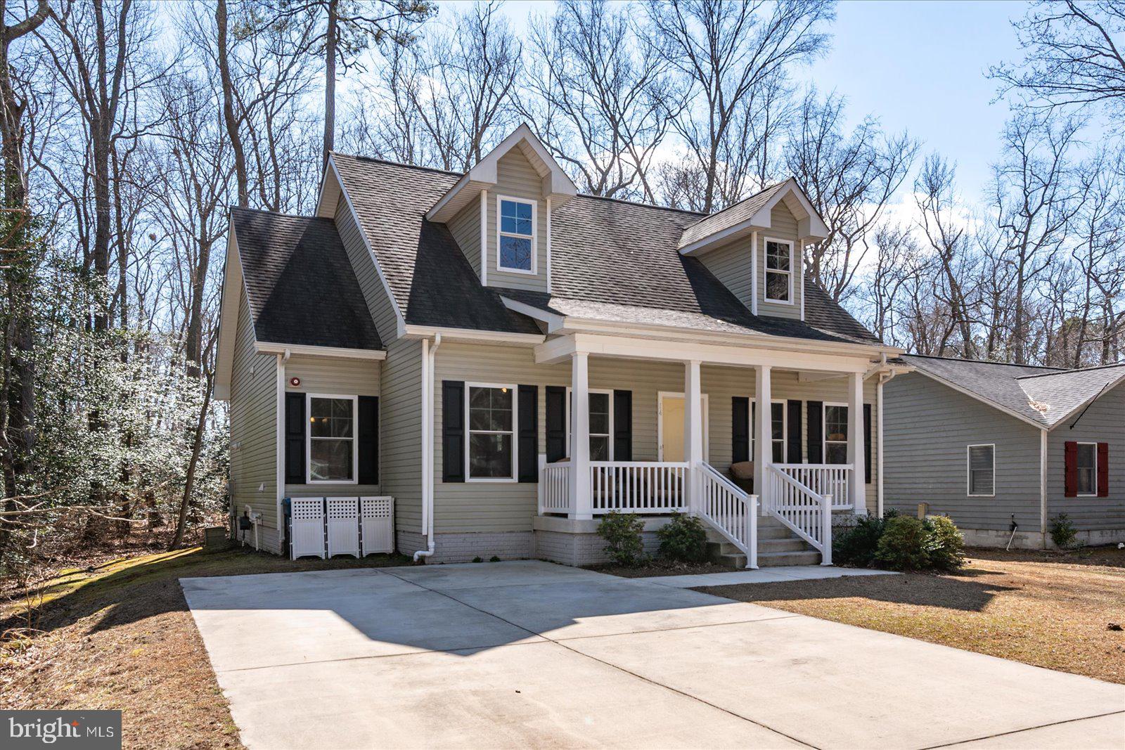 This 3 bedroom 2 1/2 bathroom home was built by energy efficient award winning builder, Insight Homes. The current original owners have enjoyed this property and made improvements in their nearly 6 years of ownership. The lovely cape cod design has a large front porch and a rear deck and patio offering plenty of outdoor space. As you step inside you will appreciate the large living area with ceiling fan leading to the oversized kitchen with dining area. This level features a half bath and laundry room as well as a storage closet and pantry. The primary suite is also located on this level and features a walk in closet. The upgraded kitchen includes stainless steel appliances, luxury vinyl plank flooring, granite countertops, subway tile backsplash, and plenty of cabinets for storage. Also, note the large stainless steel sink with a view of the backyard and garbage disposal. The second floor of the home has 2 bedrooms and a bathroom, as well as a small area at the the top of the steps that is currently used as a sitting area, but could be used for a desk. Exiting the home from the kitchen you have a deck with access to a utility closet for extra storage. Off of the deck is a patio for lounging or grilling. This home was built with energy efficiency in mind including a tankless hot water heater and heat pump with gas backup for cold winter days. The home is well insulated and have energy efficient windows allowing for reasonable utility costs. The crawlspace was encapsulated at the time the home was built. Ocean Pines is a community that offers access to an abundance of amenities and is very close to the beach as well as downtown Berlin. Put this home on your list to tour today!